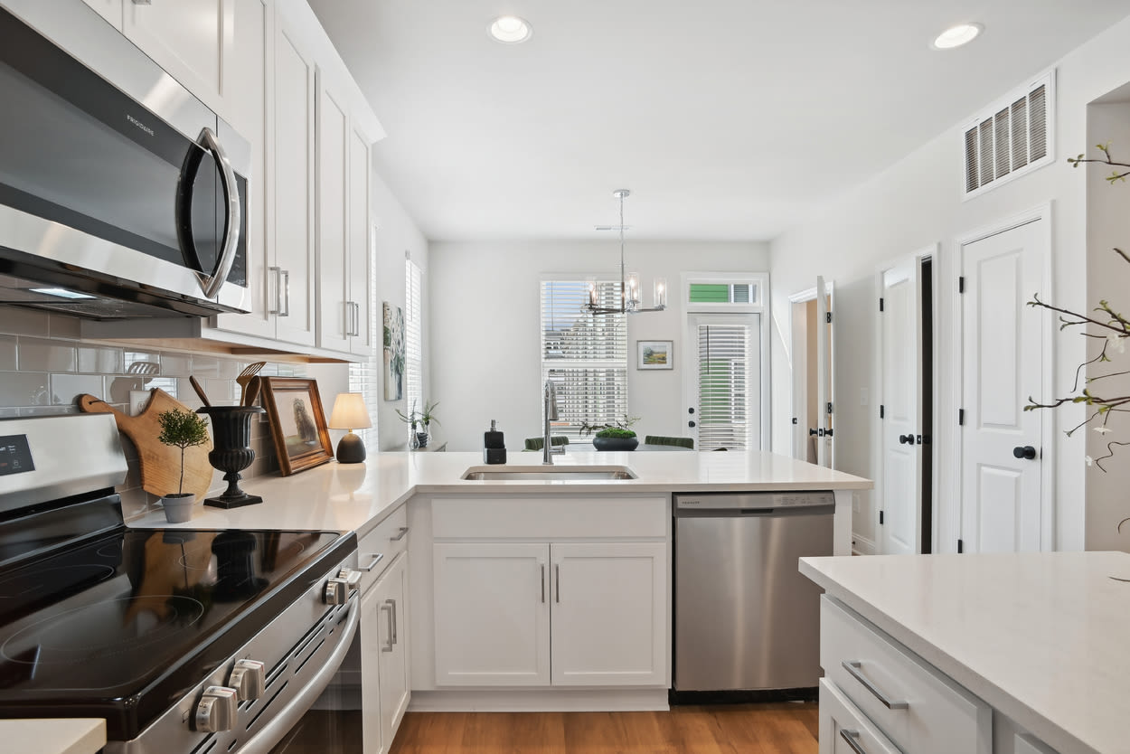 Kitchen with stainless-steel appliances at Towns At Eastland in Charlotte, North Carolina