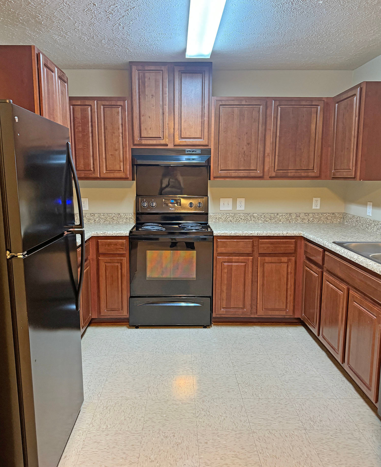 Kitchen with wood accents Coldwater Ridge in Kannapolis, North Carolina