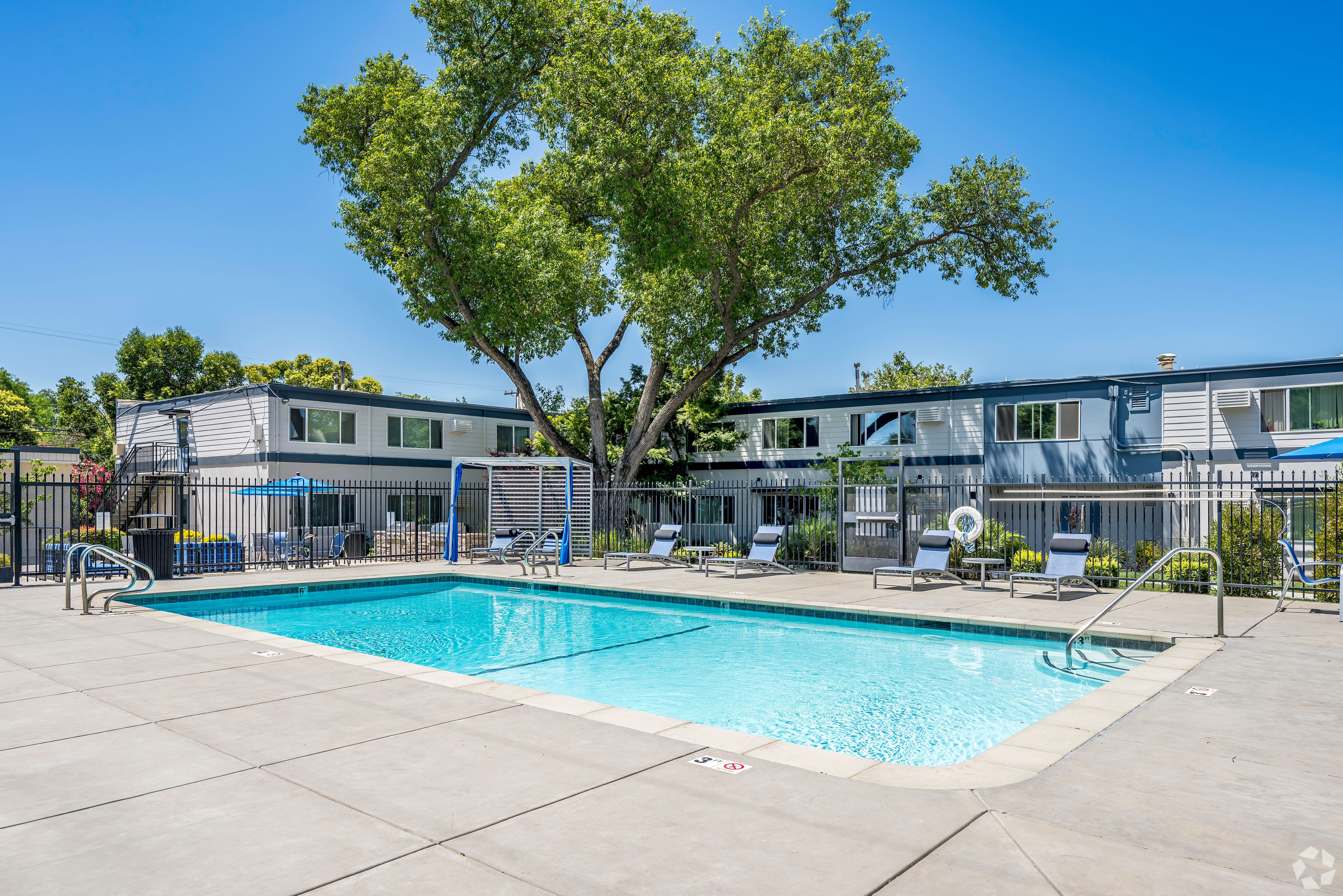 Outdoor pool at Academy Lane Apartment Homes in Davis, California