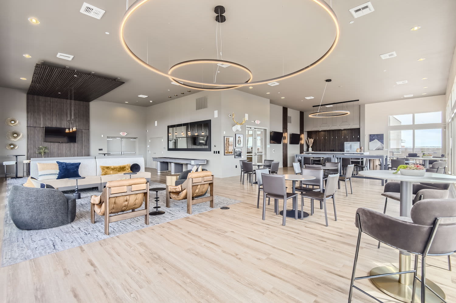 Community clubhouse with a kitchen area and seating at Elevation @ County Line Station in Englewood, Colorado