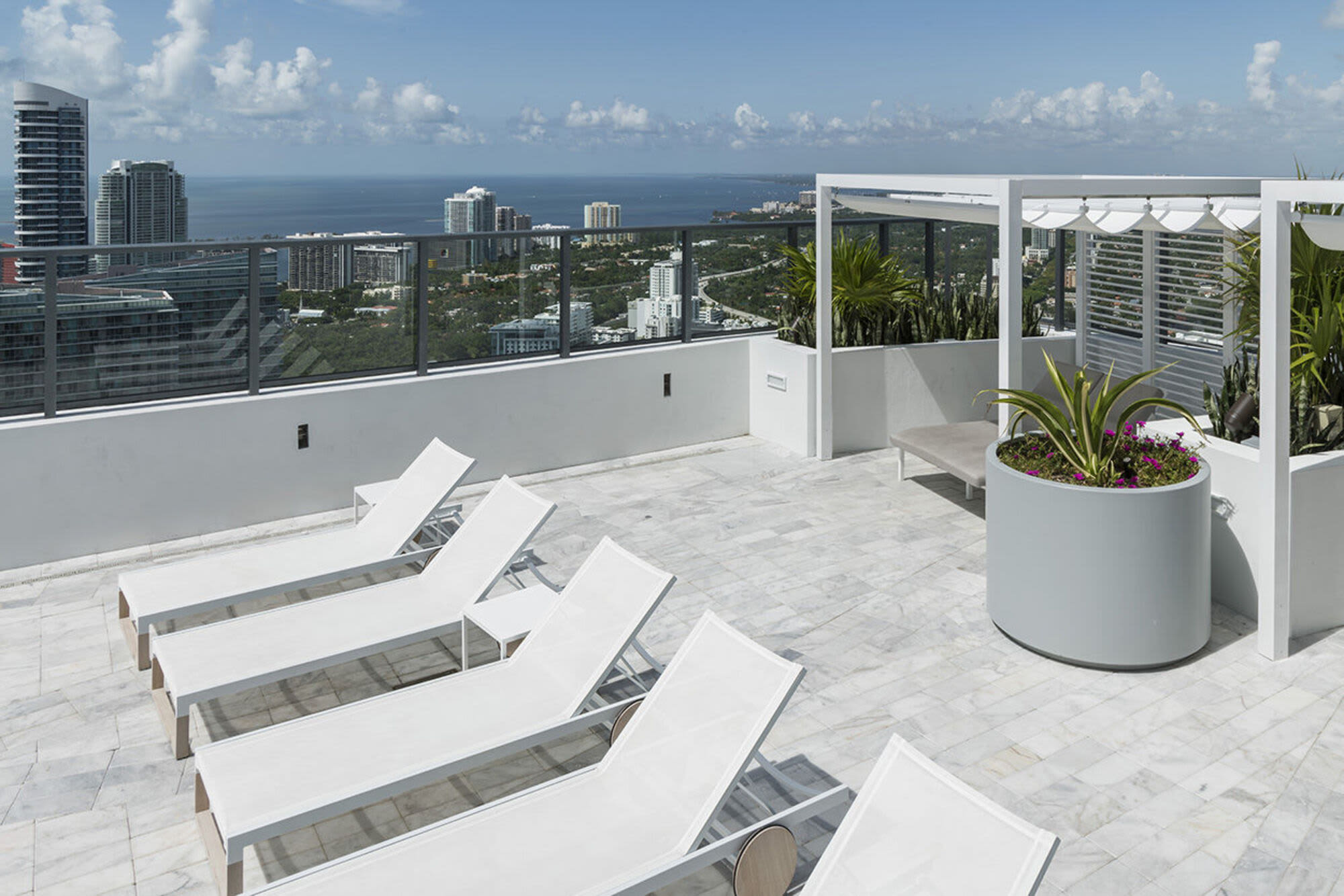 Poolside sun loungers at Solitair Brickell Apartments in Miami, Florida