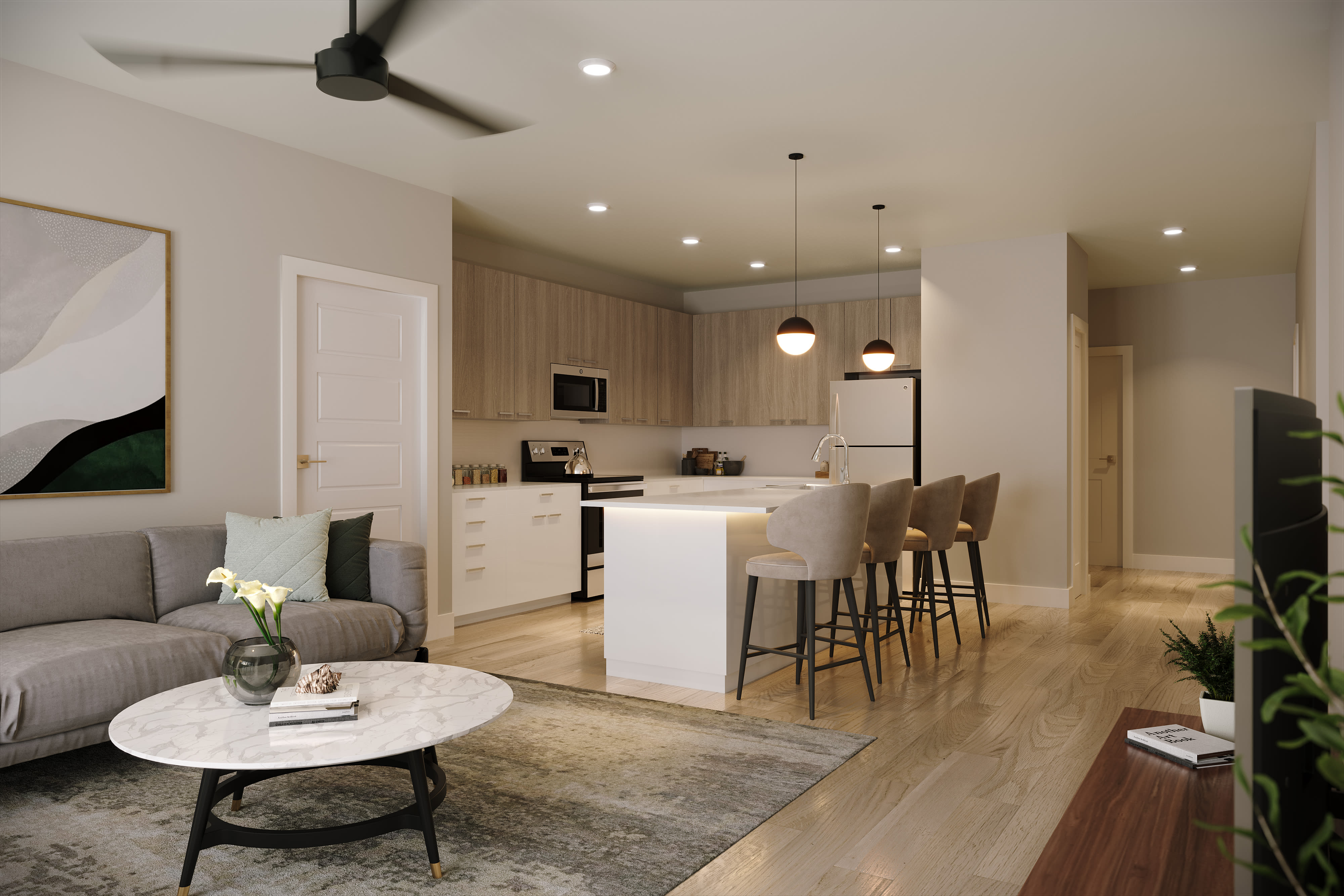 Open layout living room with easy access to kitchen at Stone Village Apartments in Reno, Nevada