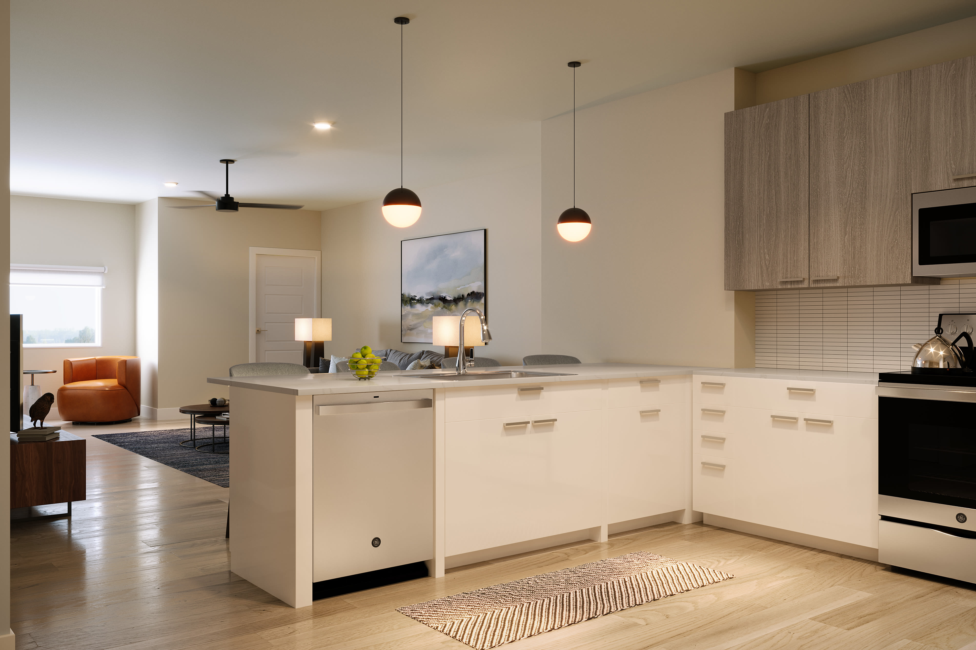 Fully equipped kitchen with white cabinets with easy access to living room at Stone Village Apartments in Reno, Nevada