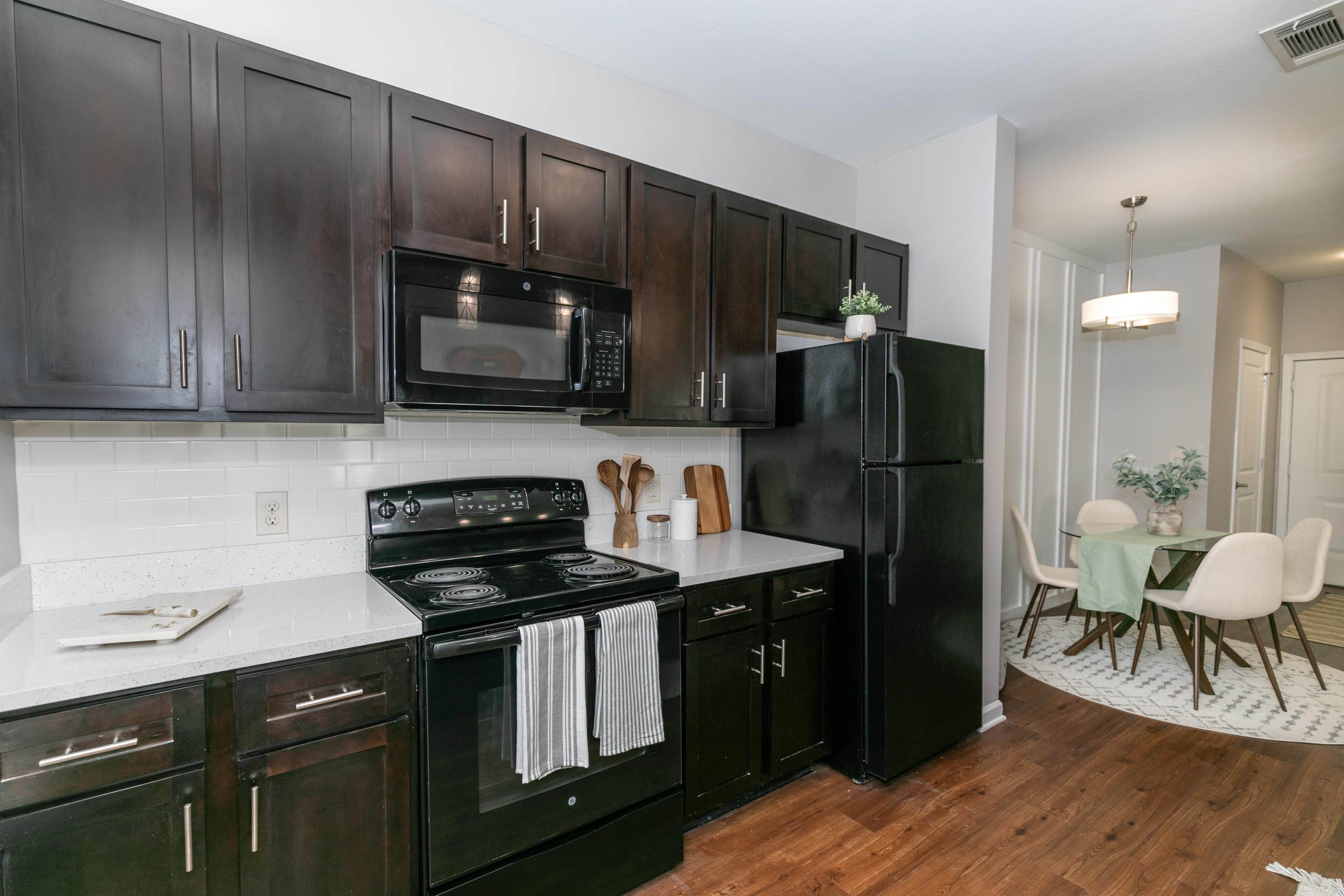 Kitchen with cabinet and appliances at Thomaston Crossing in Macon, Georgia