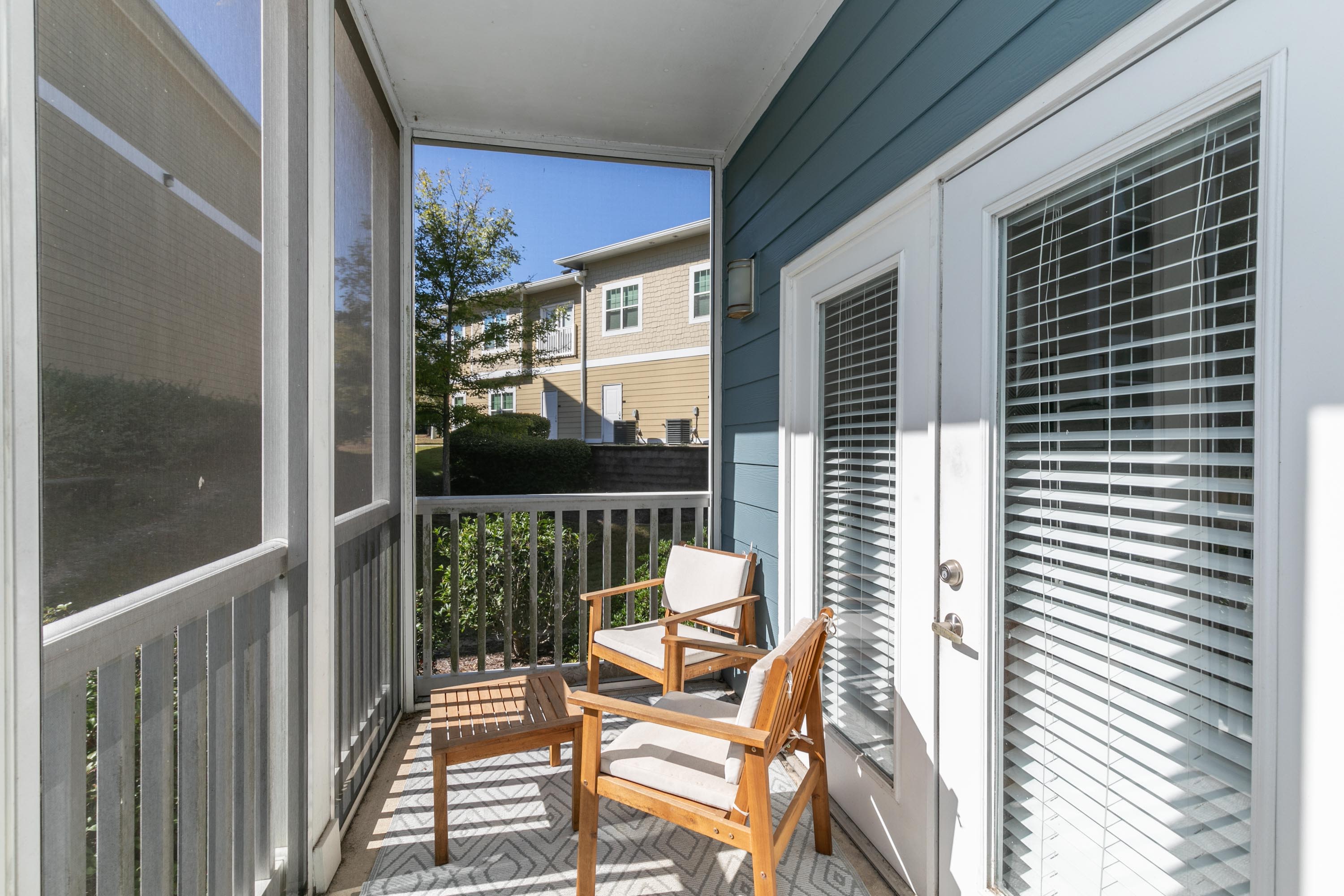 Balcony with a chair and a table at Thomaston Crossing in Macon, Georgia
