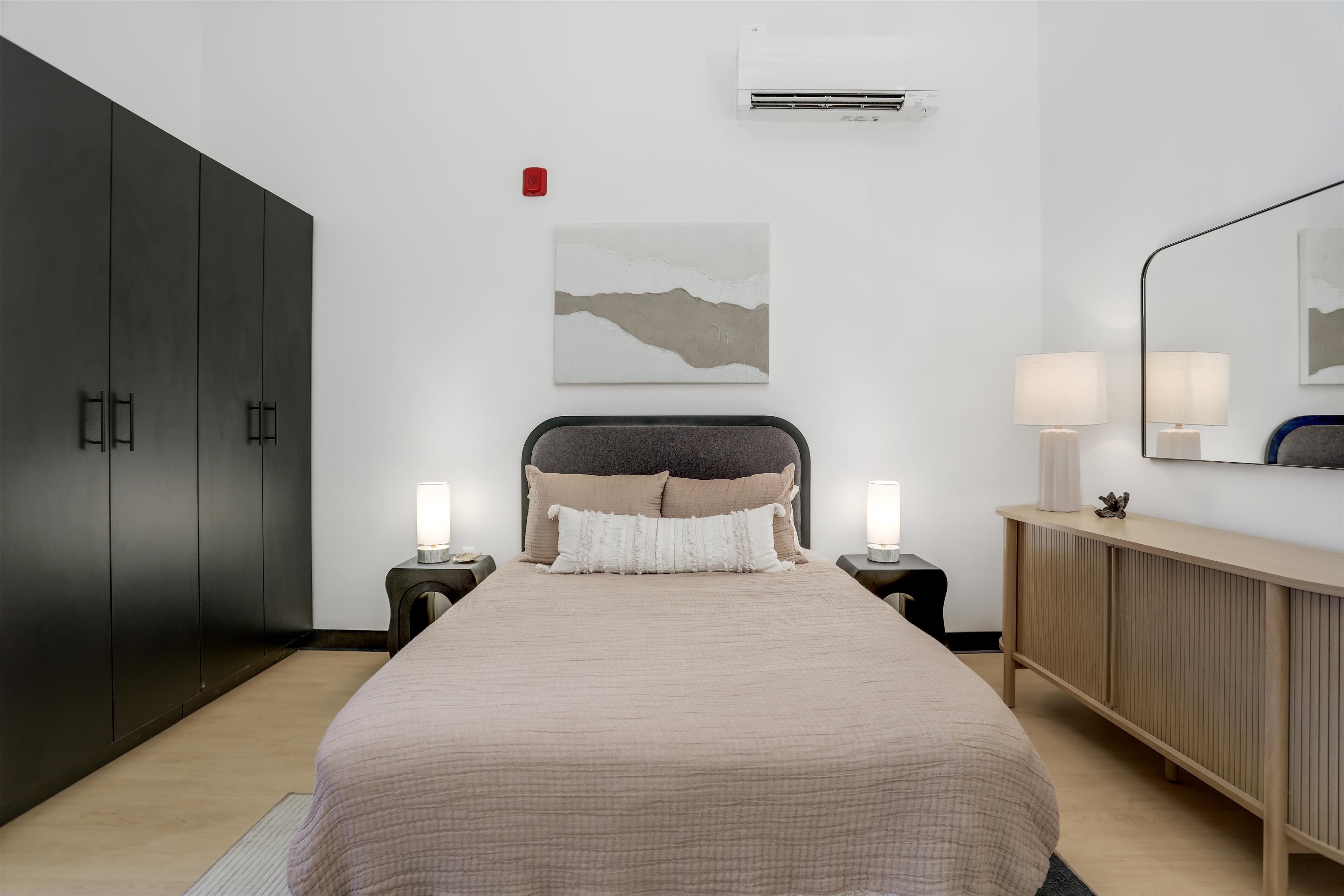 Bedroom of apartment at Piquette Flats in Detroit, Michigan
