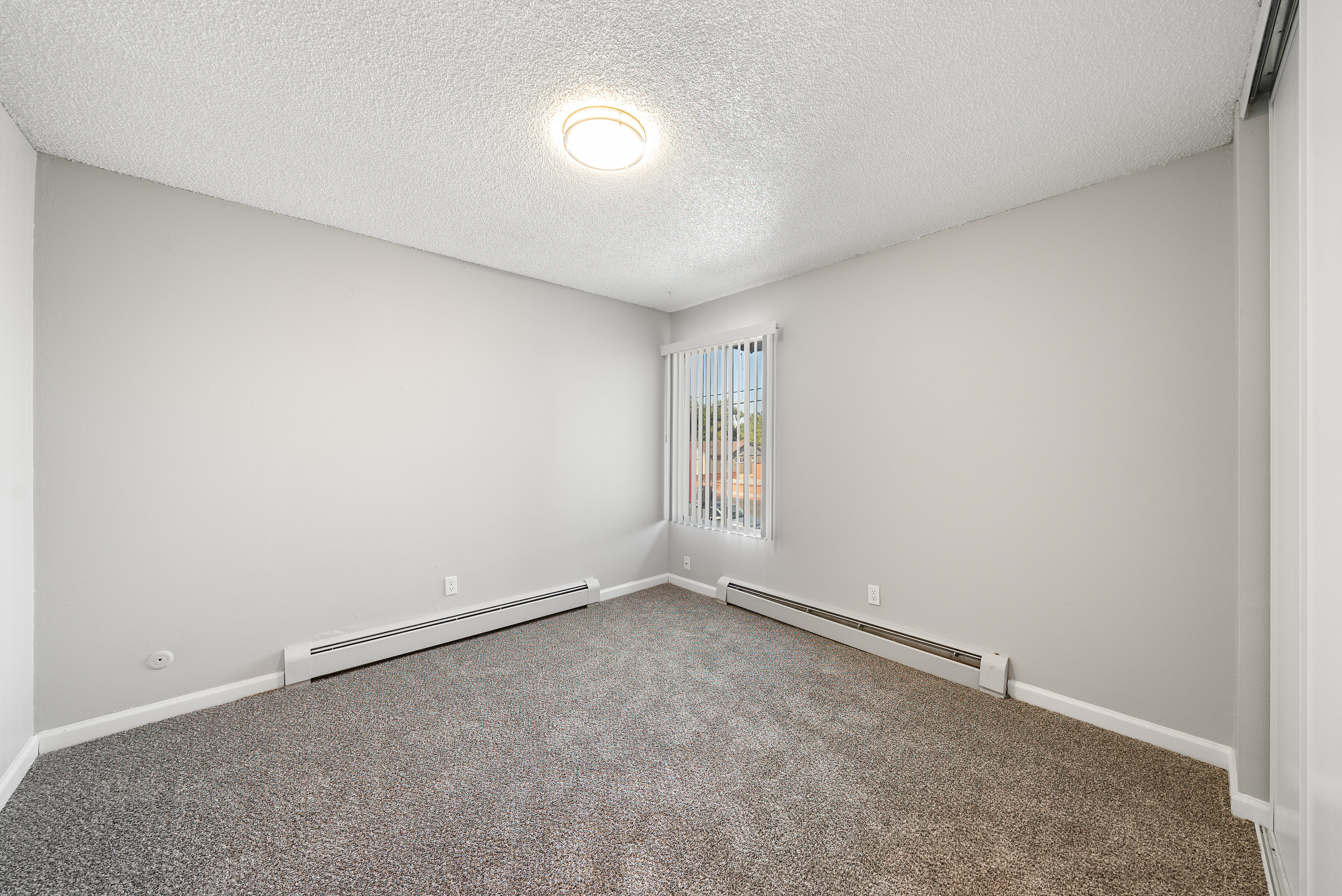 Spacious bedroom with window at The Meadows in Sparks, Nevada