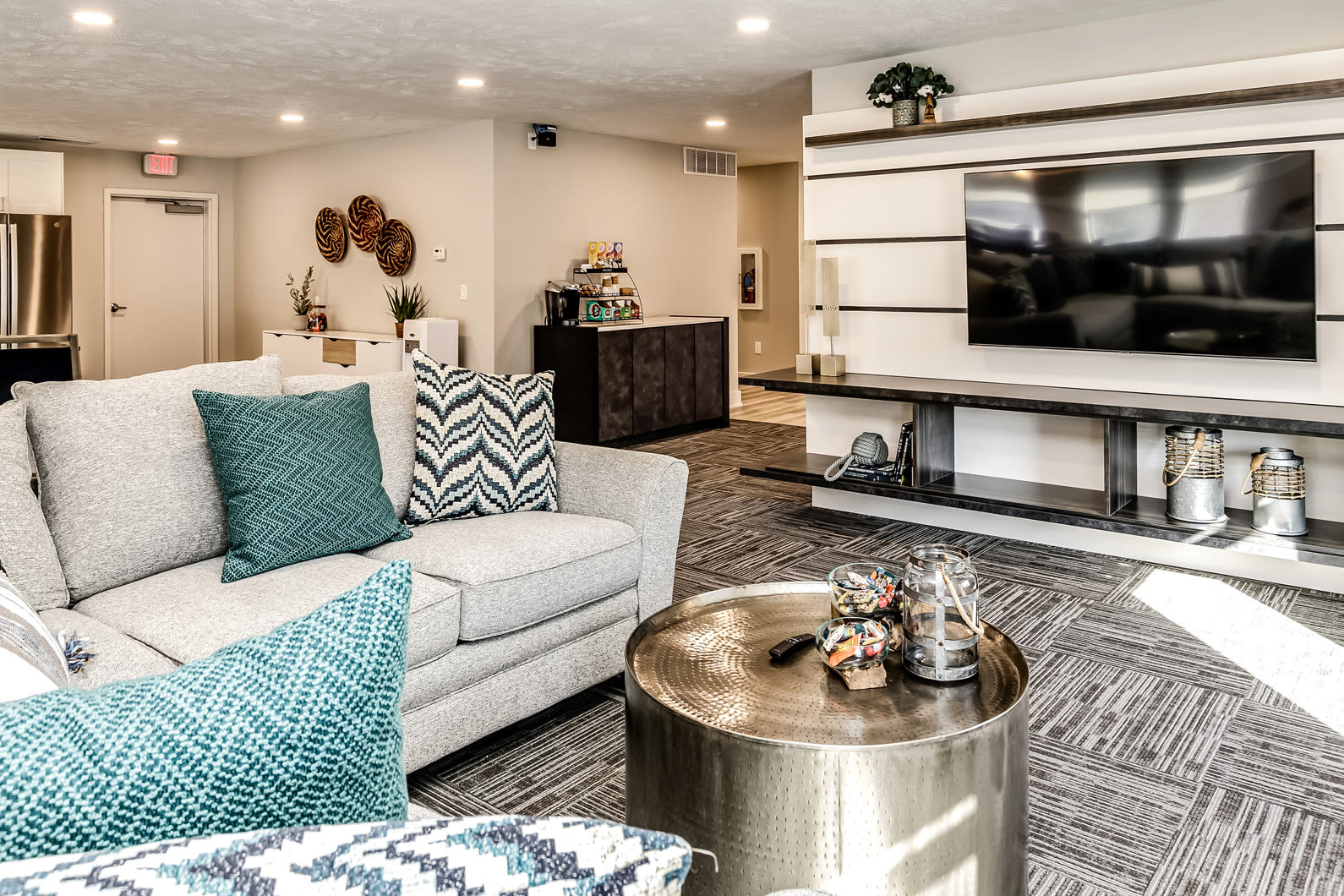 Clubhouse living area with television at The Falgrove Apartments in Omaha, Nebraska