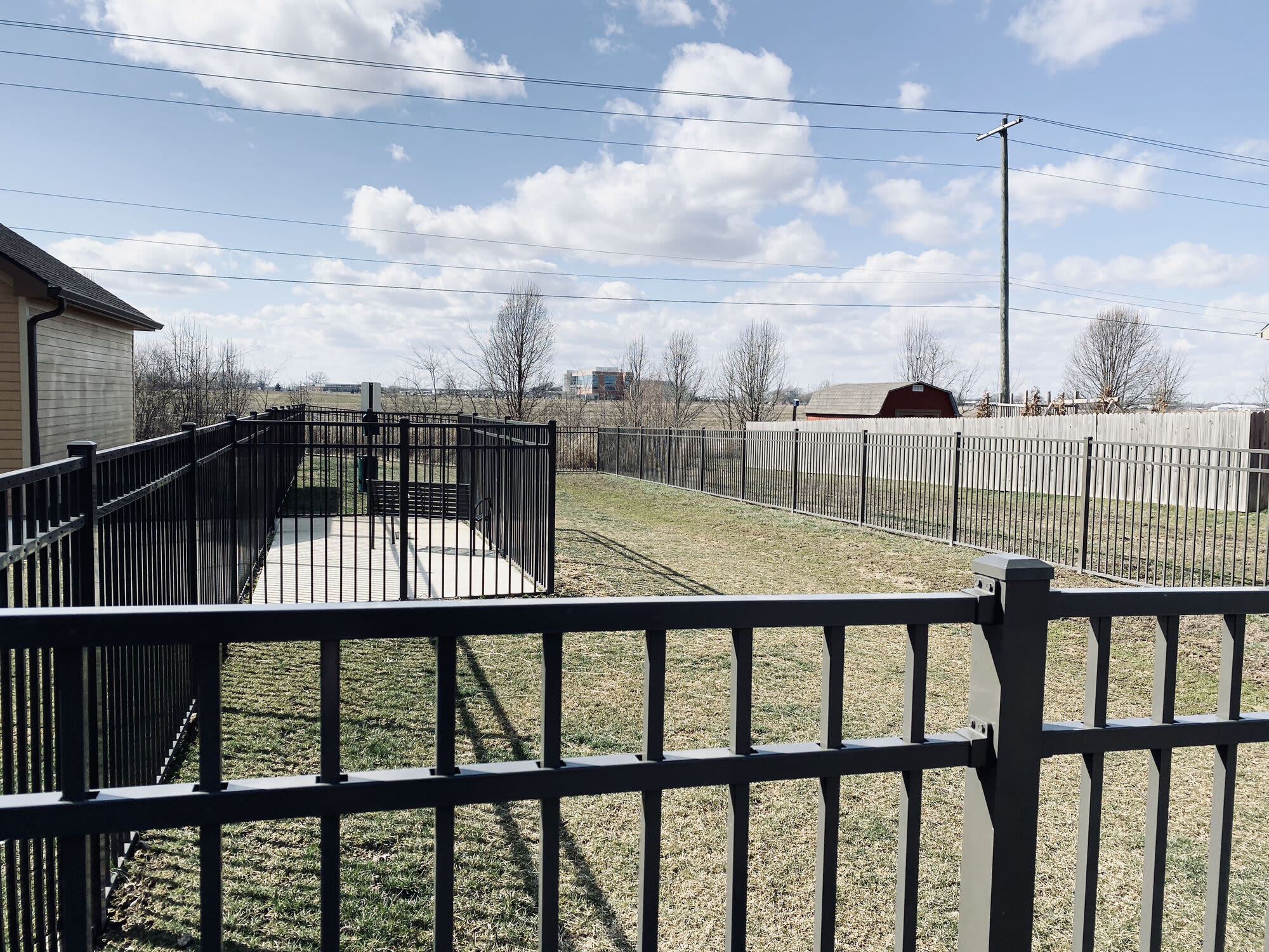 Community featuring black metal fencing at Warrick Trail Apartments in Newburgh, Indiana