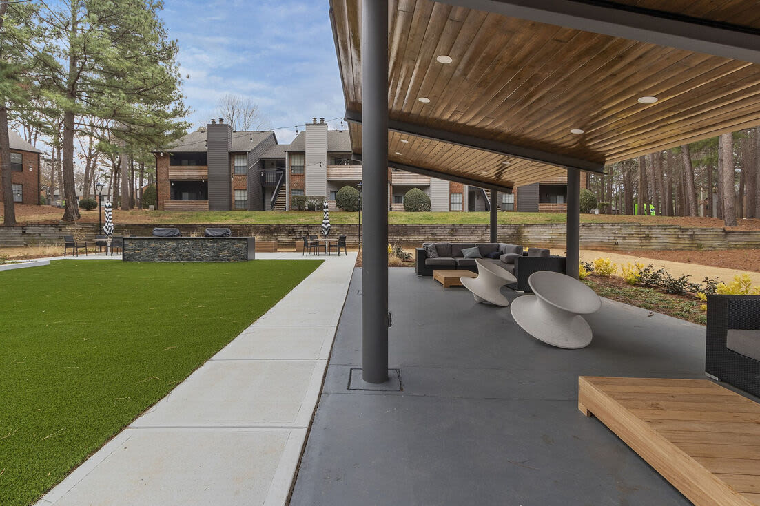 Community lounge area beside the grilling stations at Regatta at Lake Lynn in Raleigh, North Carolina