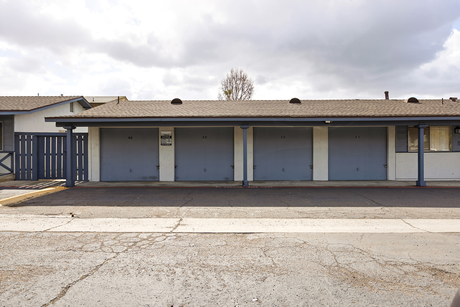 A parking lot with two garages at Terre at S Anza in El Cajon, California