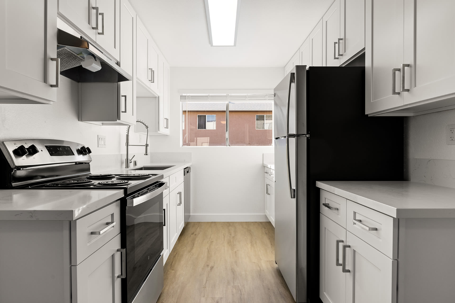 Kitchen with modern appliances at Valle at 9121 Kenwood in Spring Valley, California