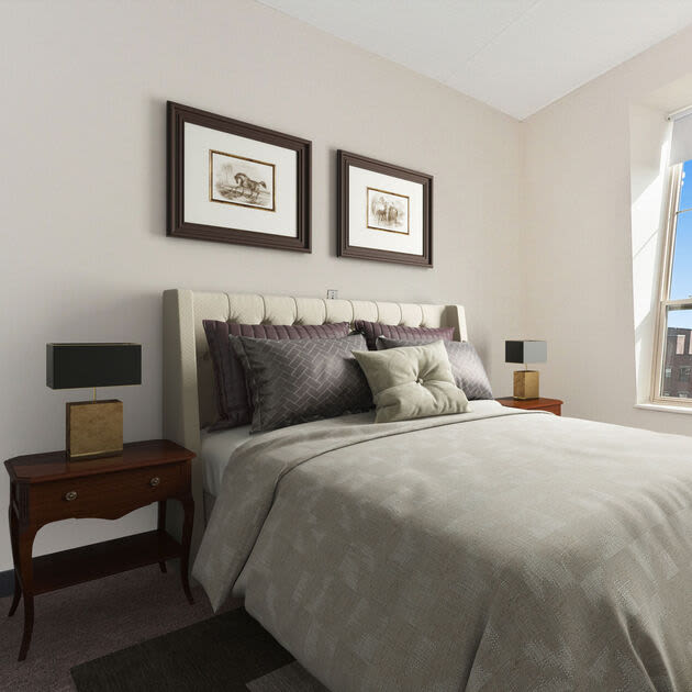 Bright bedroom with large comfortable bed at Bixby Brockton Apartments in Brockton, Massachusetts, 