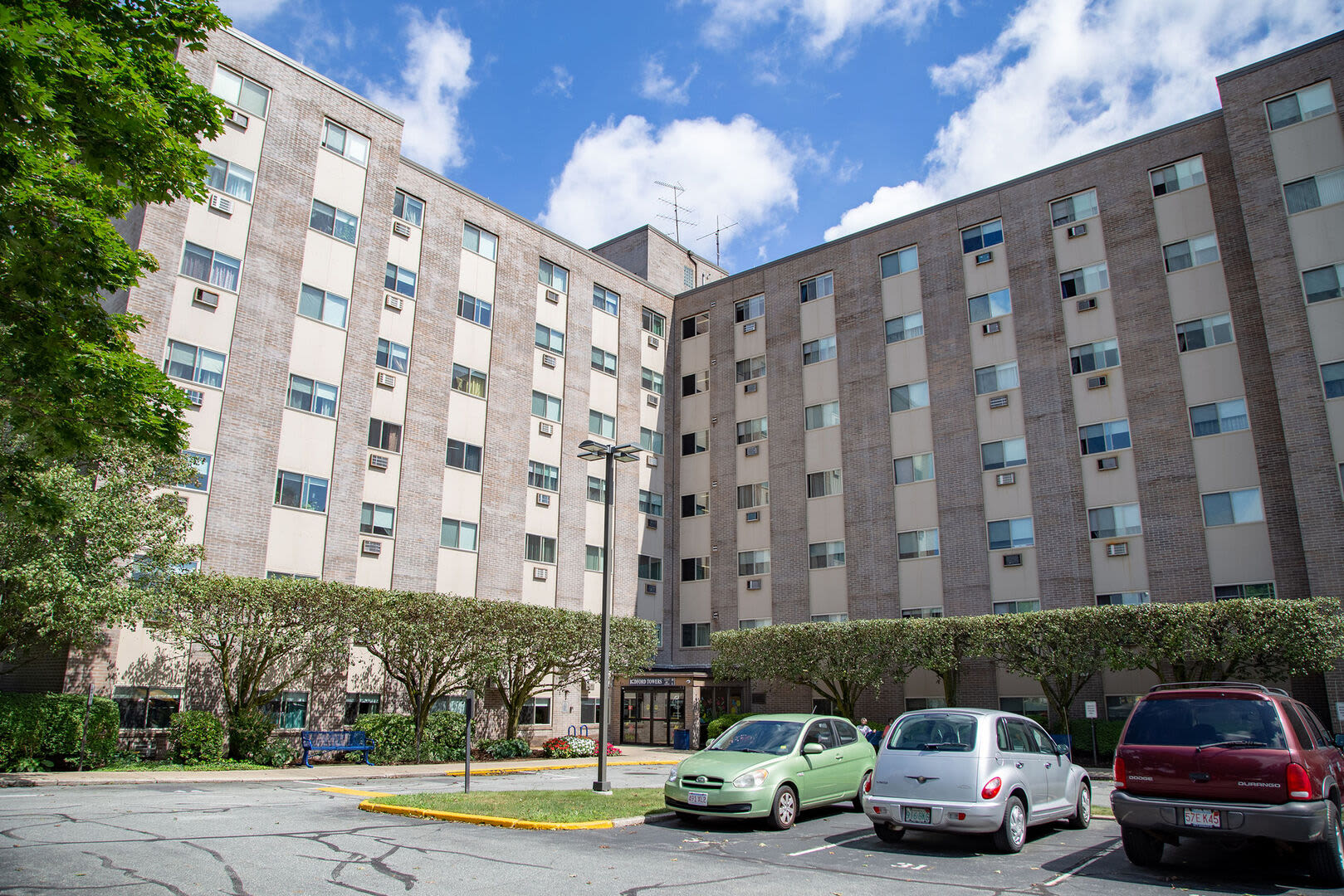 High-rise apartments with a view of car parking space at Bedford Towers in New Bedford, Massachusetts