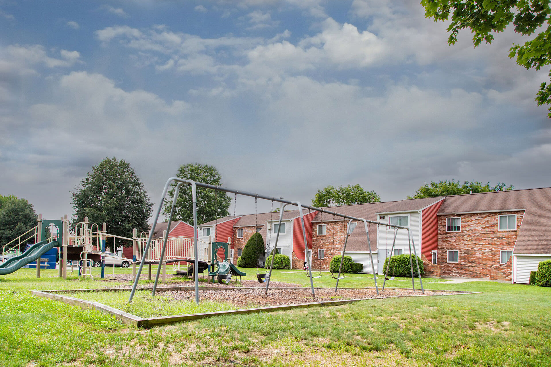 Swings and slides in the playarea for kids at Bedford Towers in New Bedford, Massachusetts