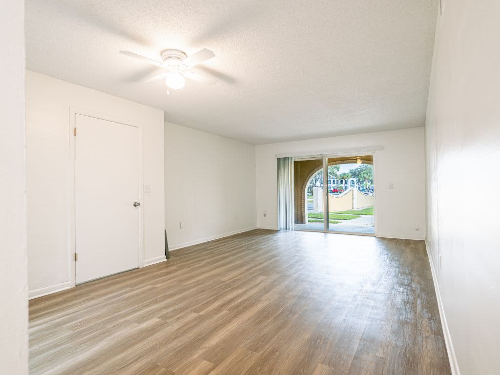 Spacious living area with access into the private patio at San Jose in Winter Park, Florida