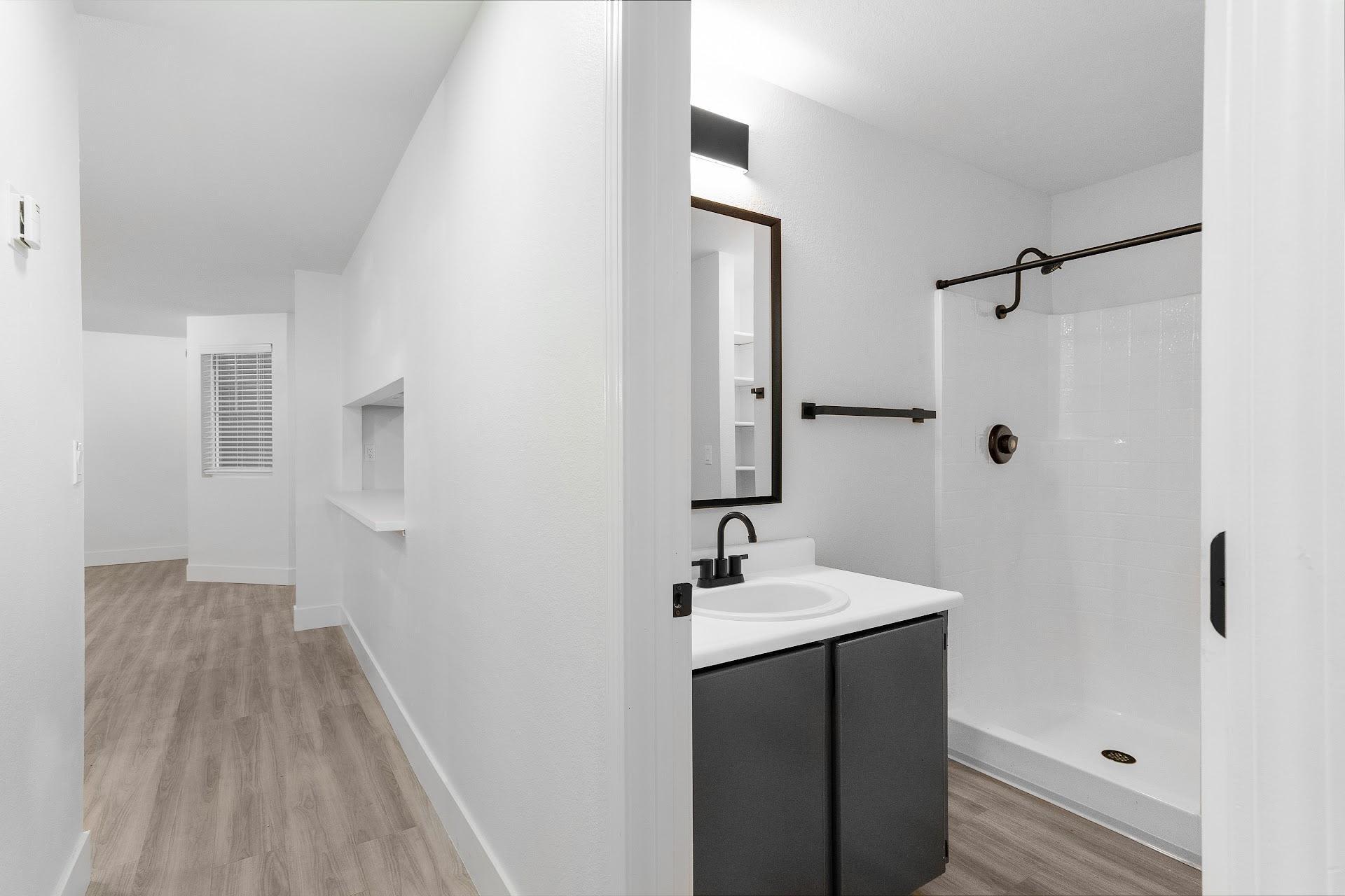 Hallway and bathroom at The Rosewood Apartments in Vancouver, Washington