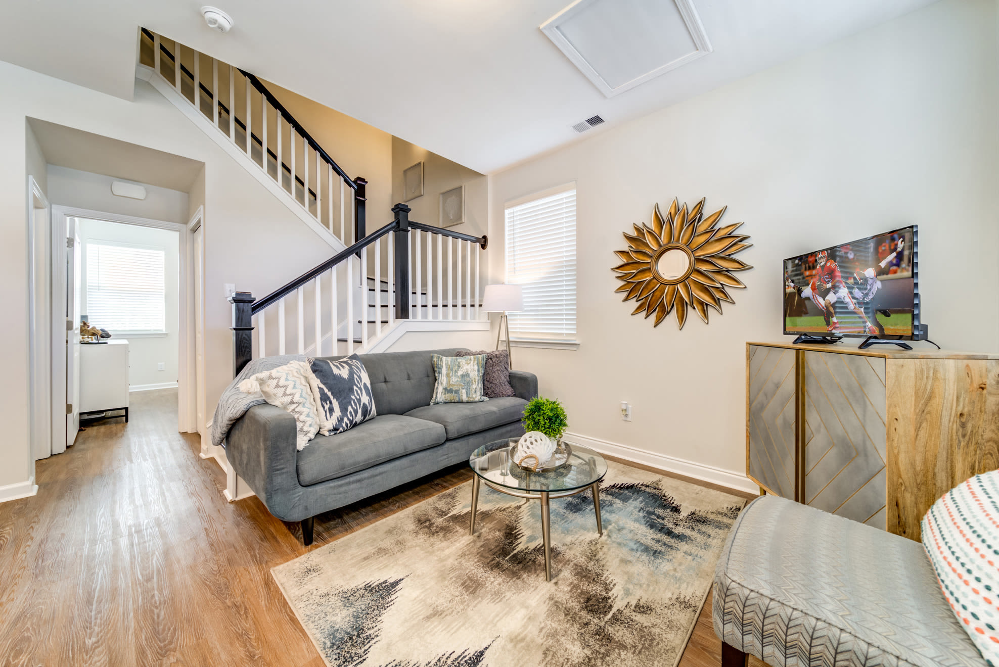Modern living room with hard wood flooring at Seaglass Cottage in North Myrtle Beach, South Carolina