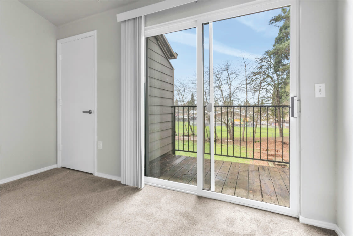 Private balcony access from the living room at Reedville Meadows in Beaverton, Oregon