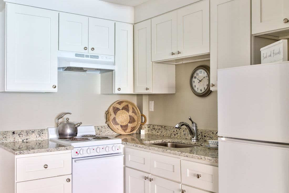 Kitchen with white color appliance at Congregational Retirement Homes in Melrose, Massachusetts