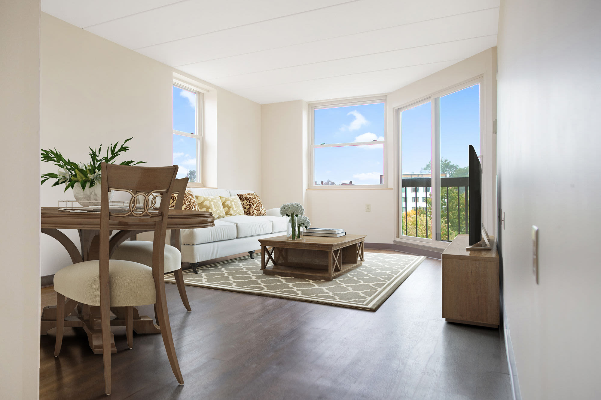 Spacious living room with large windows at Clark House in Amherst, Massachusetts, 