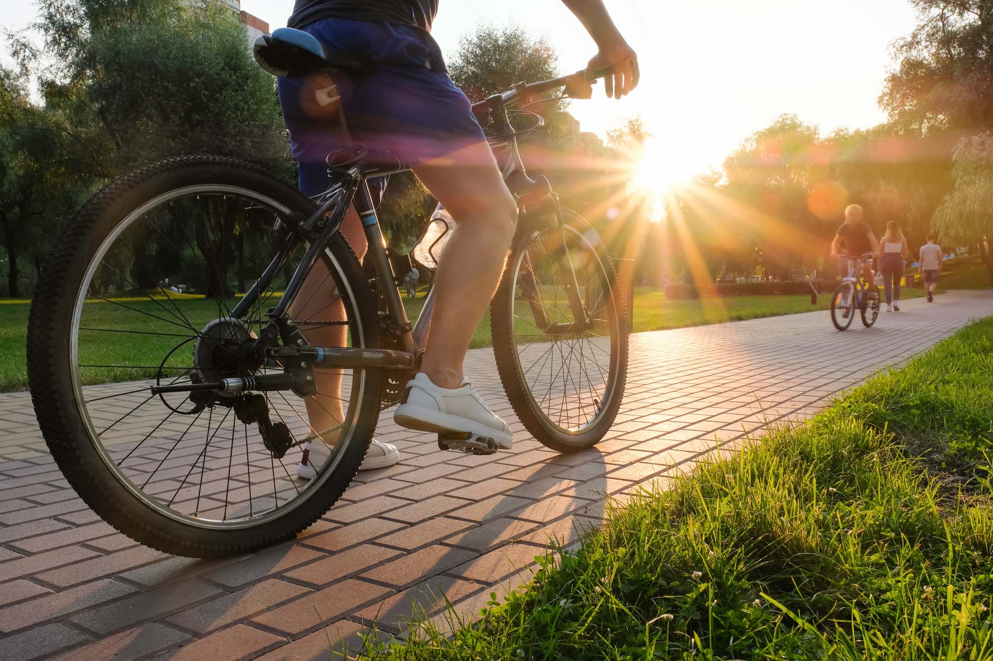 Resident riding bike at Chatham Village in Tustin, California, 