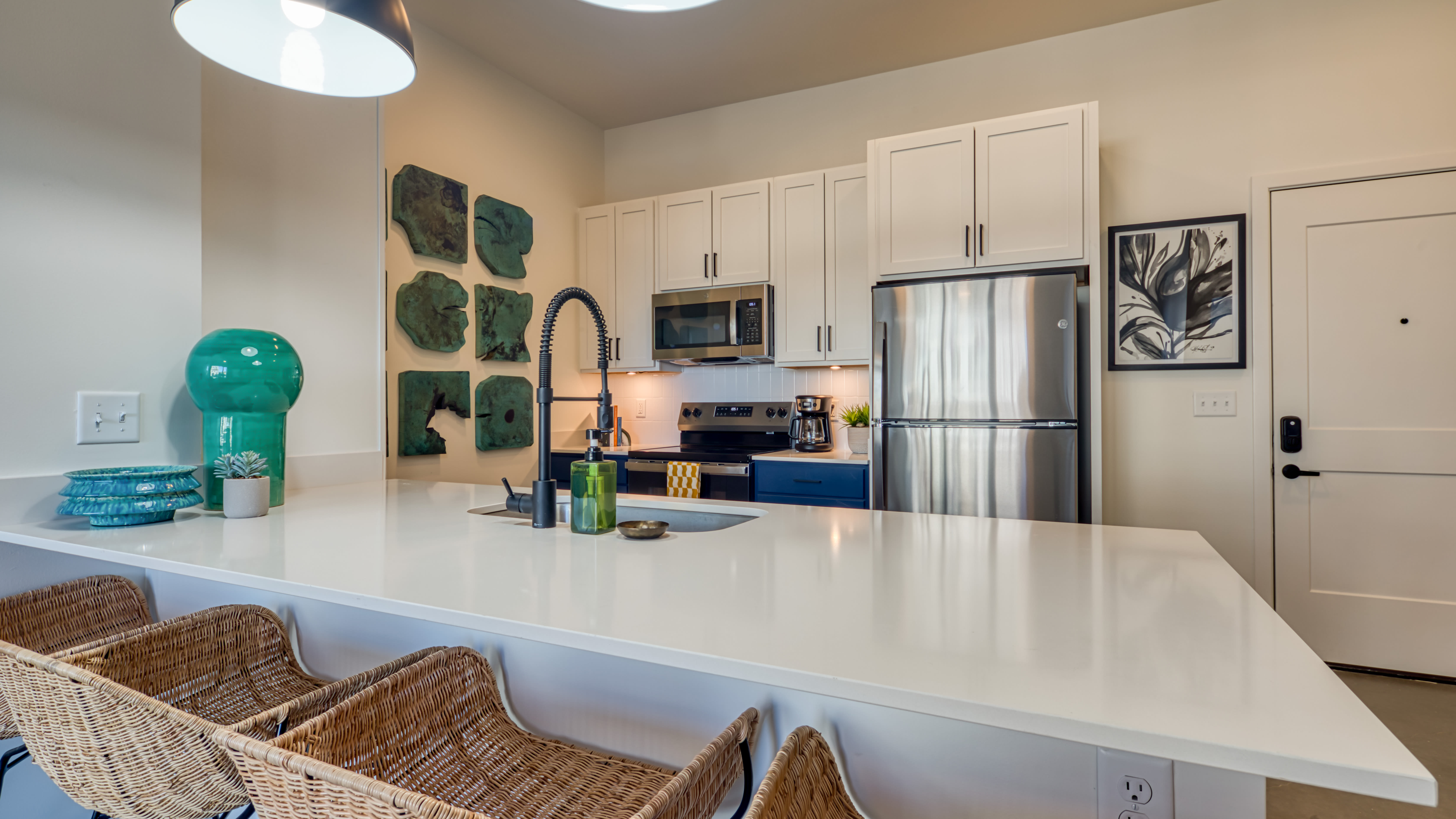 Spacious kitchen with quartz countertop and appliances at Fusion at Neon in Norfolk, Virginia