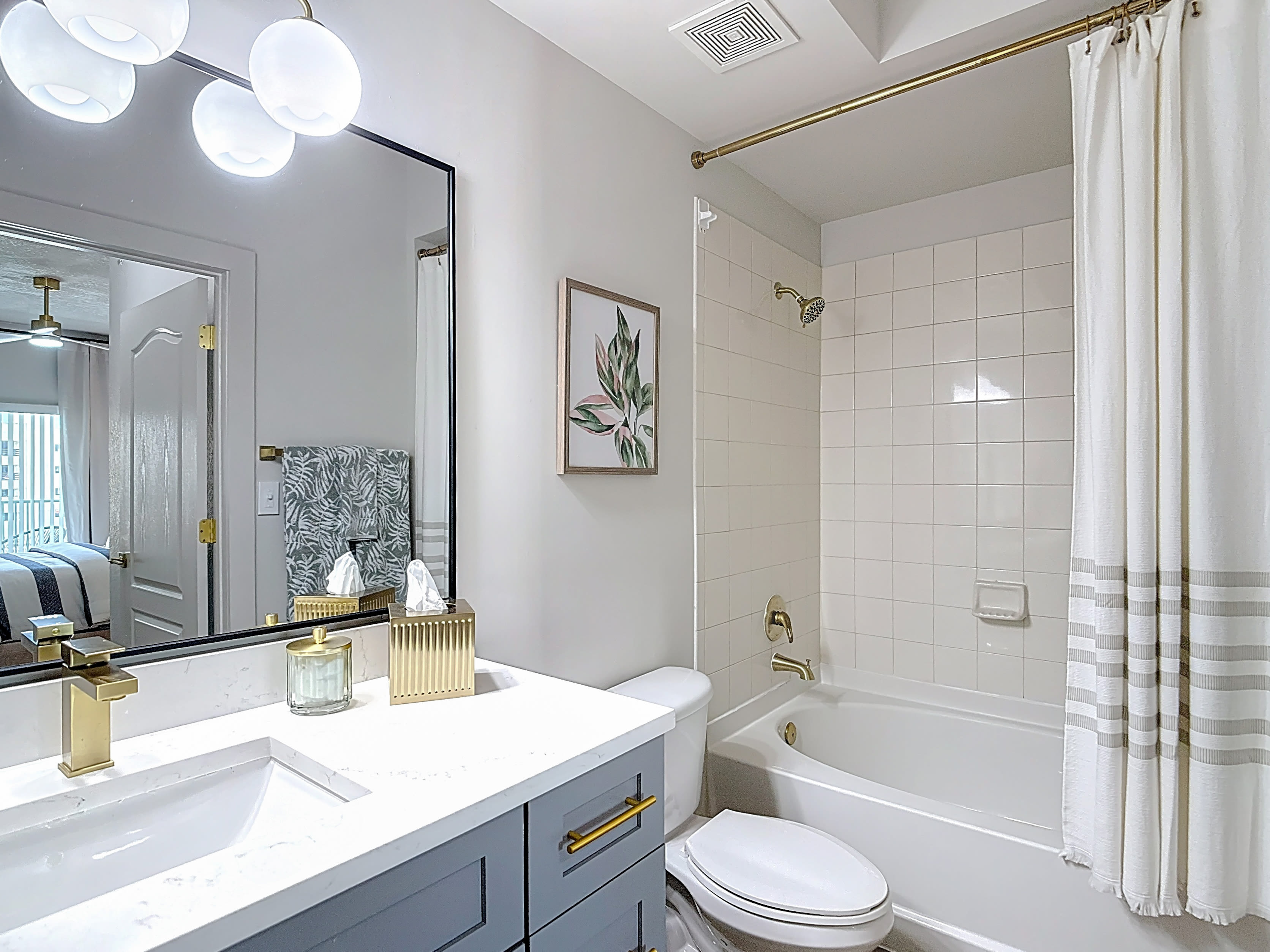 Bathroom with a shower, sink and toilet at Valencia South Miami in South Miami, Florida