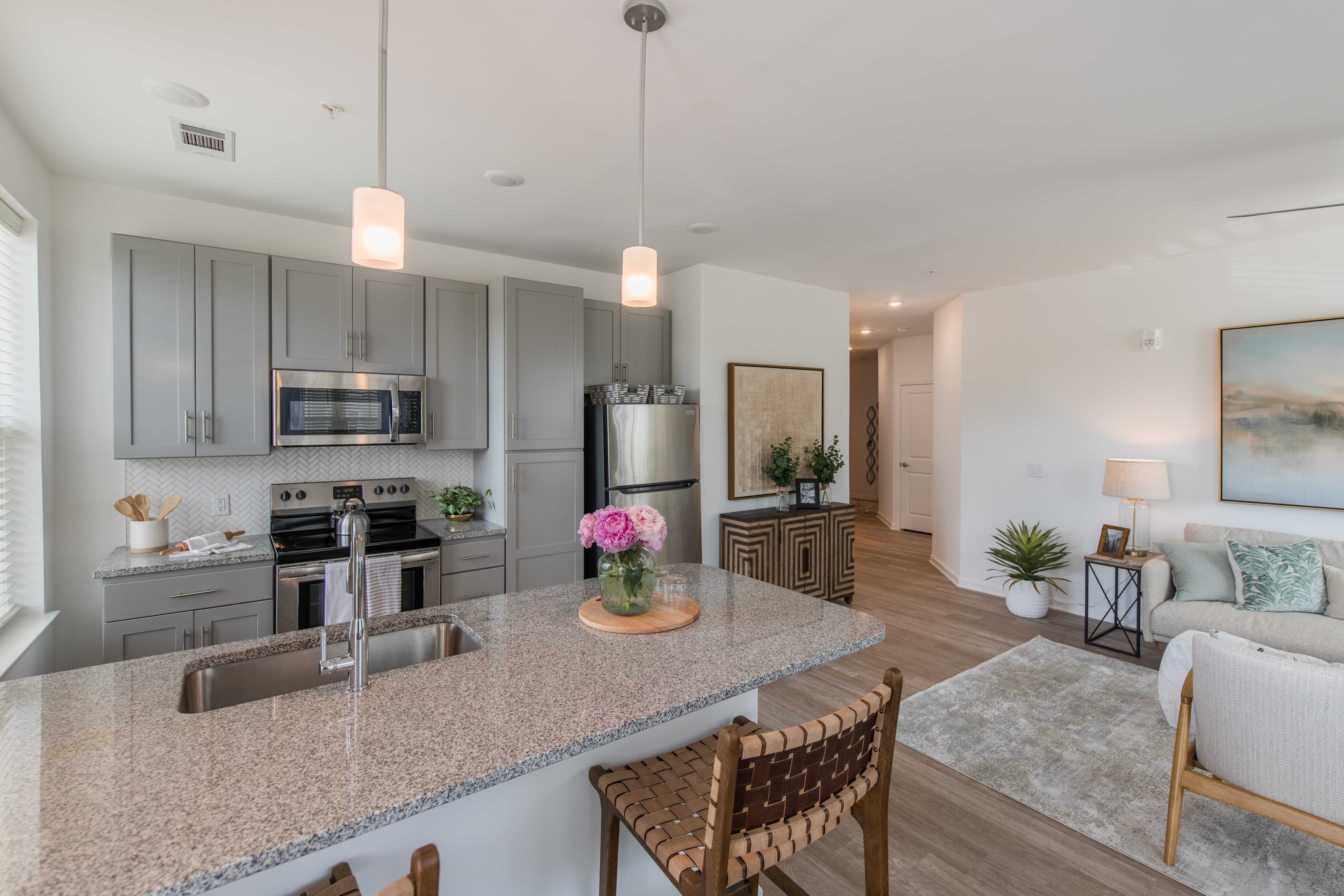 apartment kitchen with a dining island at Commonwealth Apartments in Midlothian, Virginia