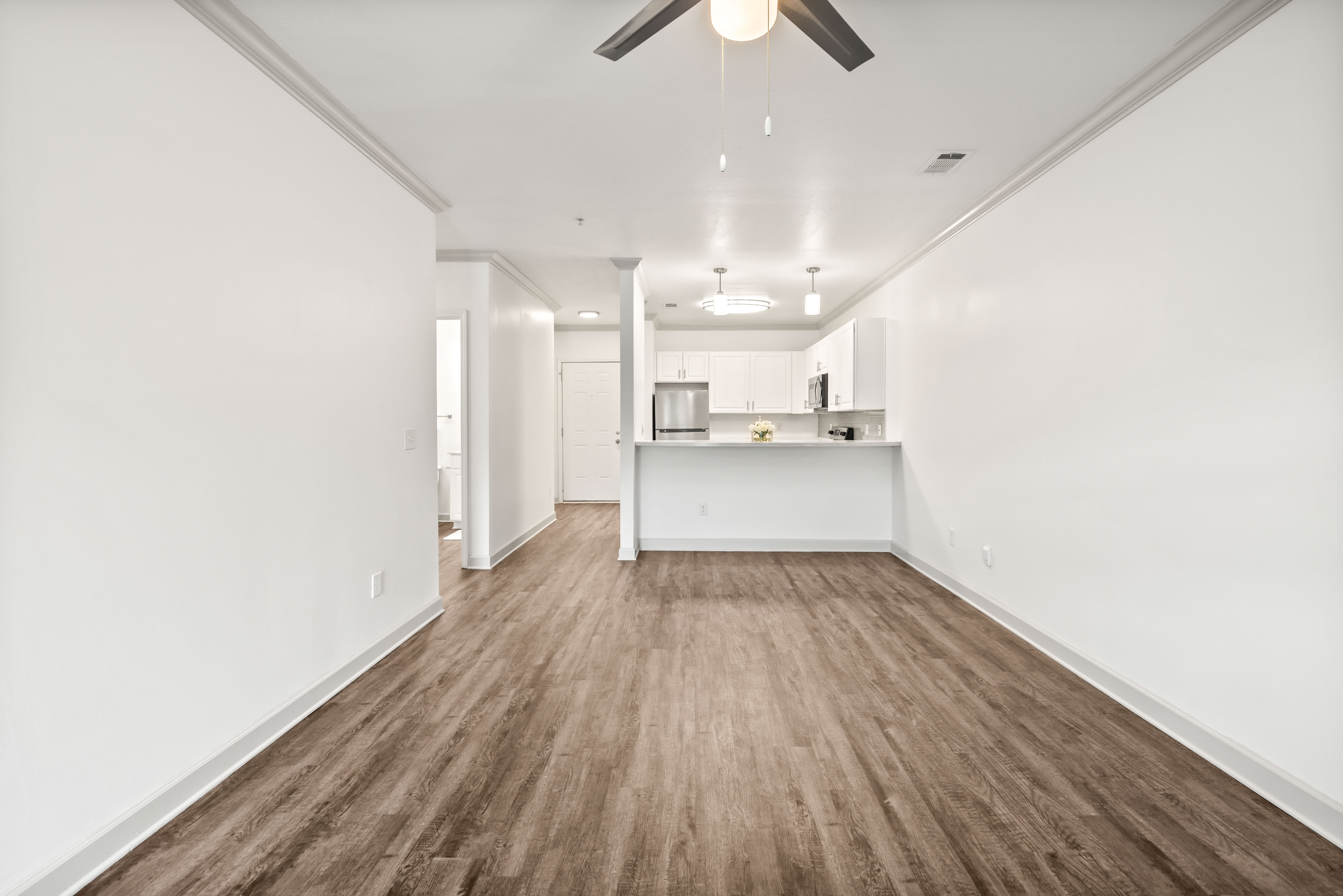 Hardwood flooring and modern living area of home at Olympus Carrington in Pooler, Georgia