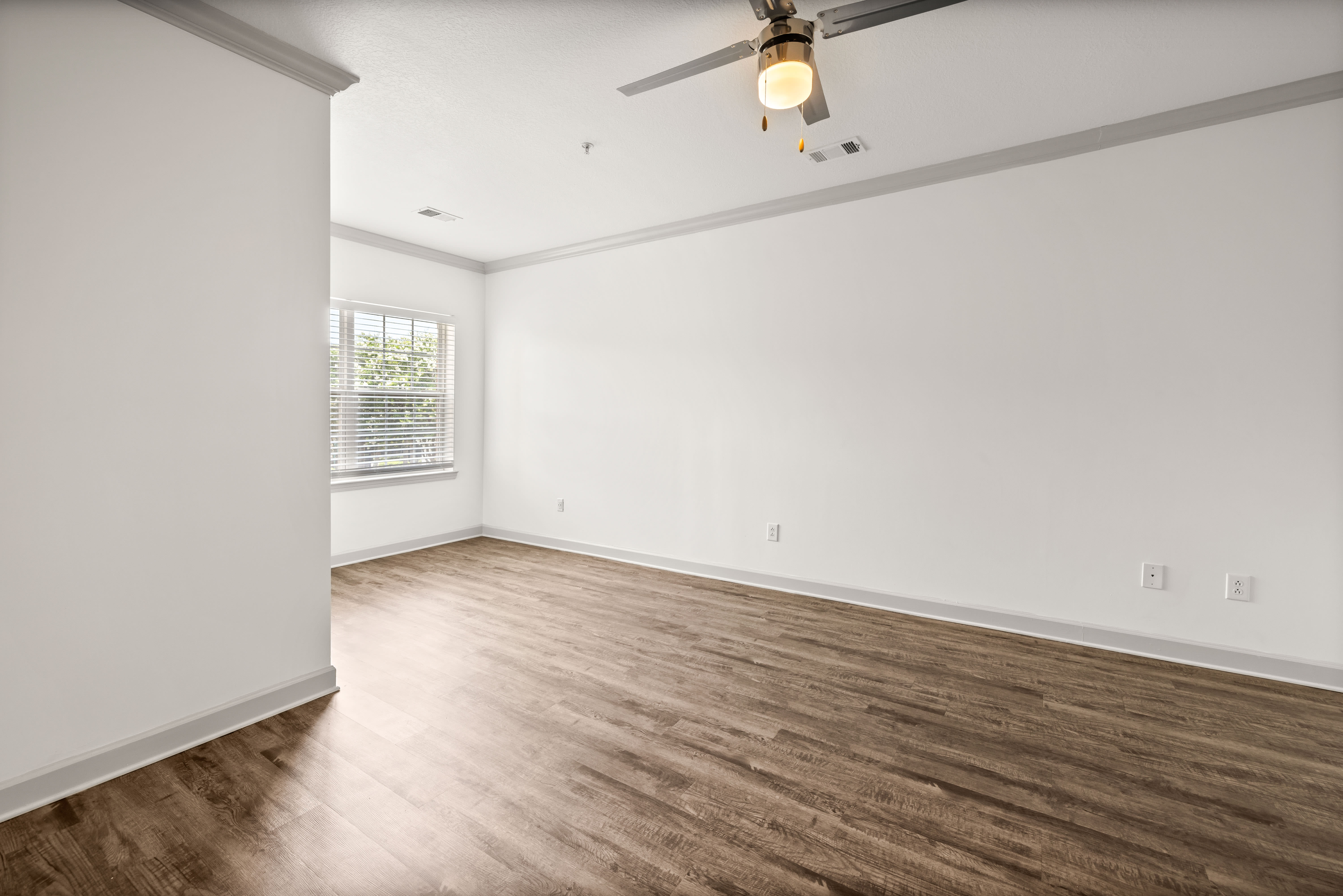 Hardwood flooring and modern living area of home at Olympus Carrington in Pooler, Georgia
