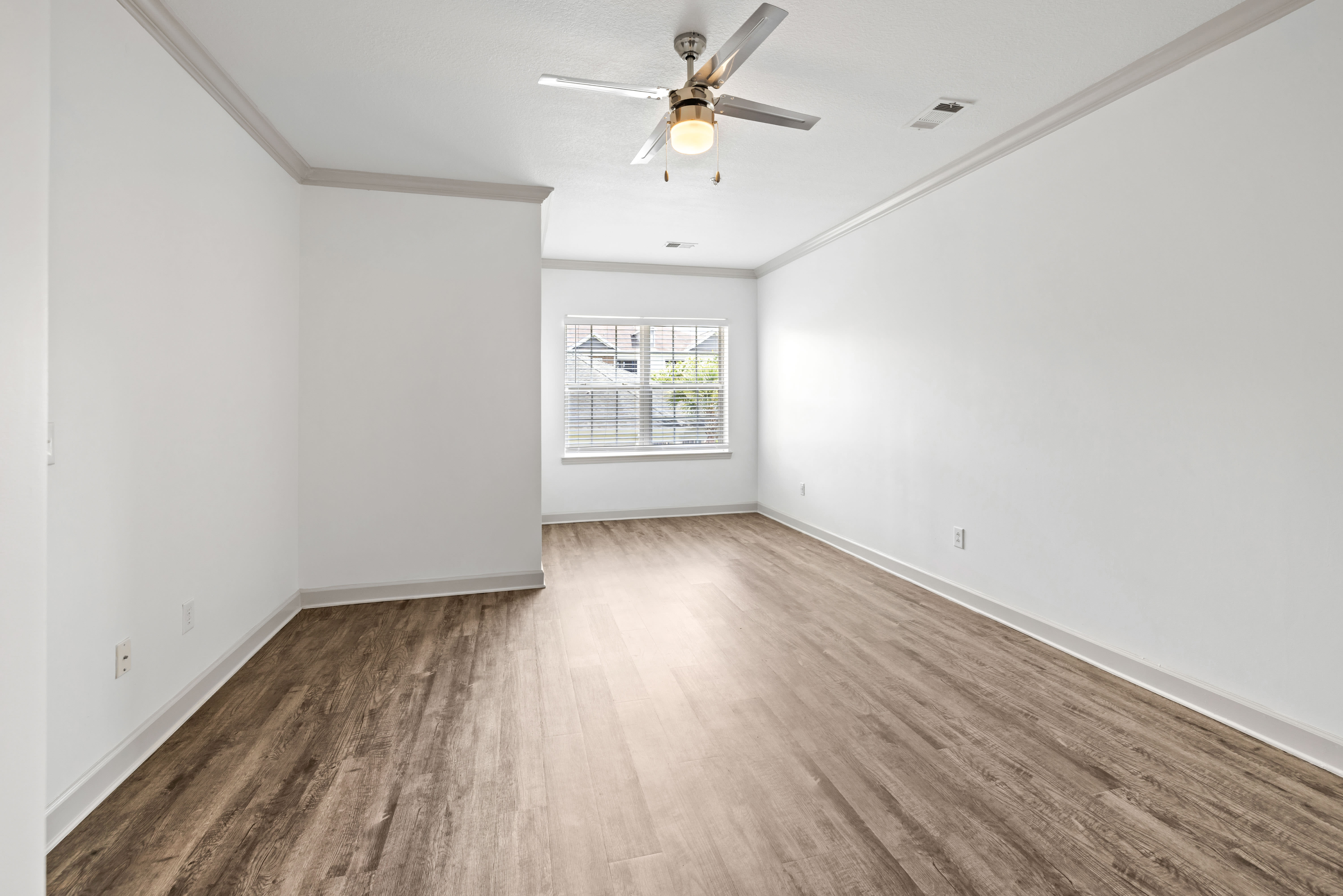 Hardwood flooring and modern living area of home at Olympus Carrington in Pooler, Georgia