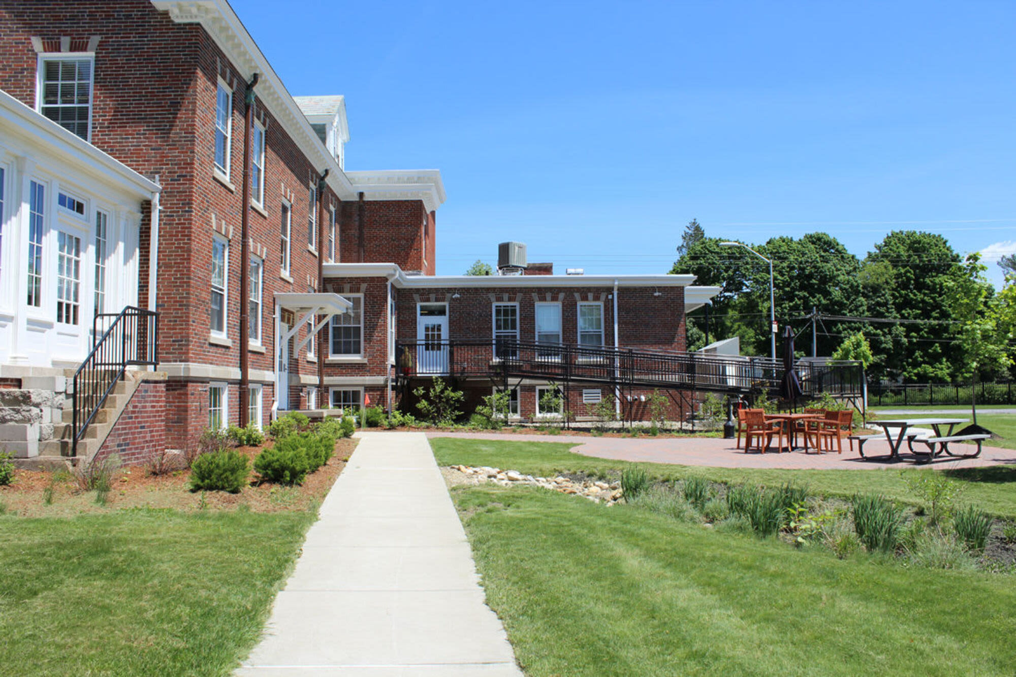 Charming community with walkway at Howard House in Brockton, Massachusetts