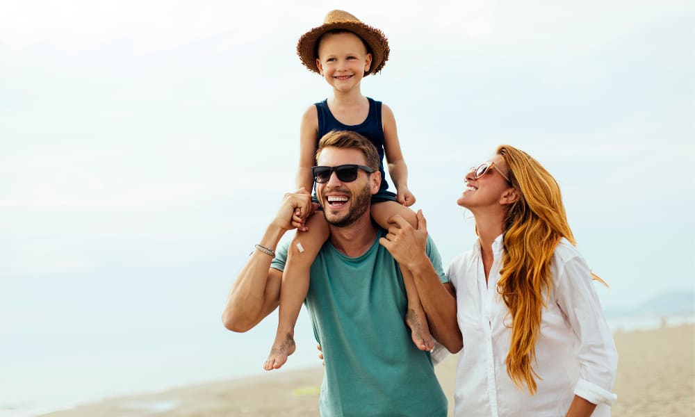Resident holding one of her thriving plants on the private balcony outside her apartment at Viva at New Smyrna Beach in New Smyrna Beach, Florida