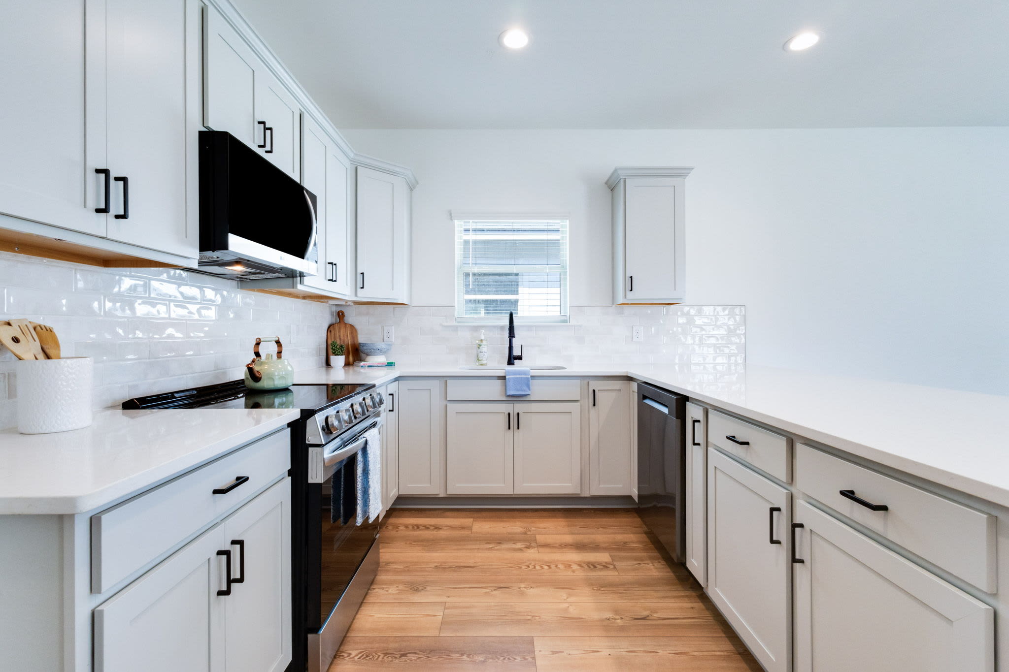 Kitchen in a model home at Cottages at Sugar Mill Pond in Youngsville, Louisiana