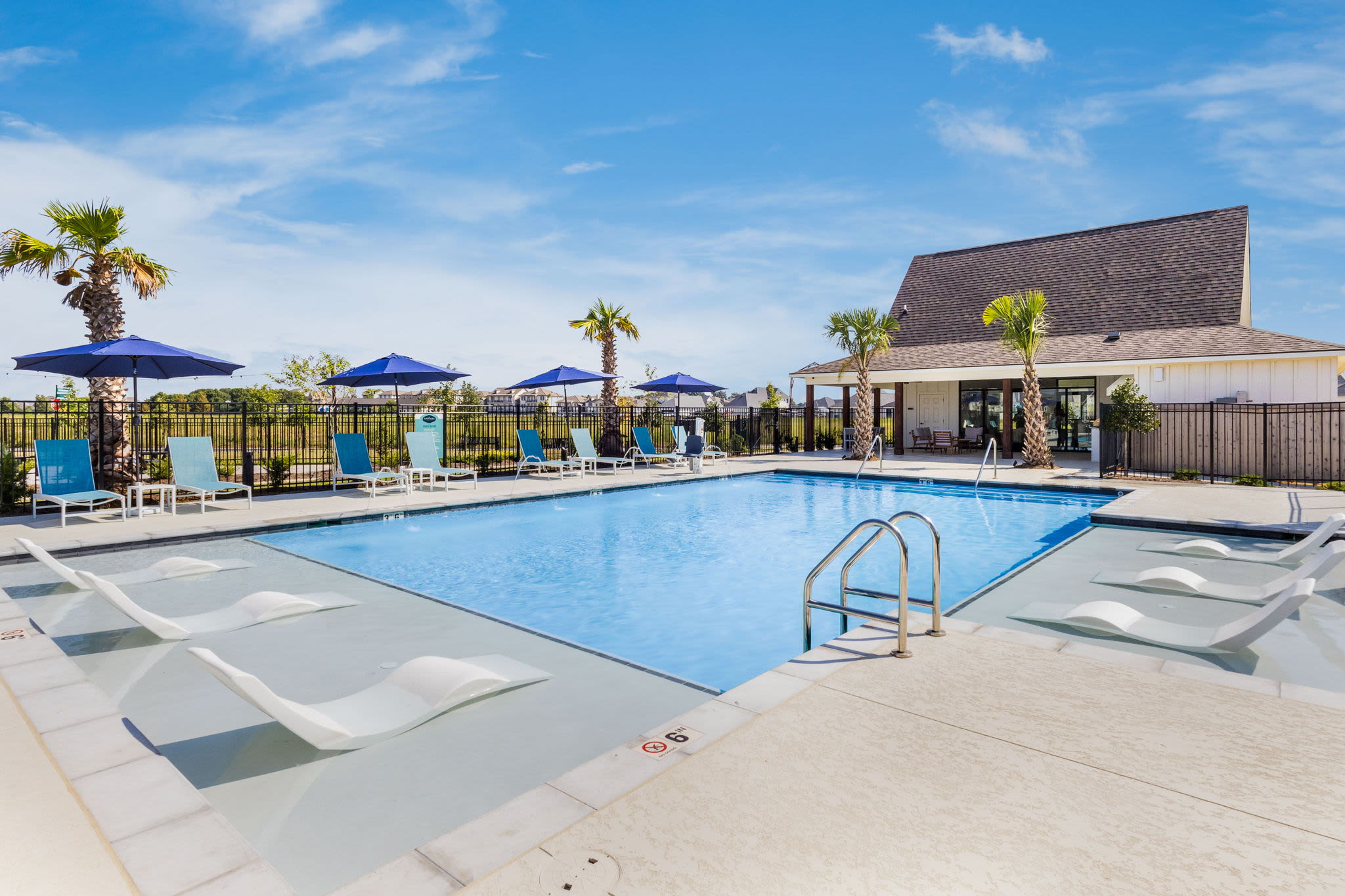 The sparkling resort-style pool at Cottages at Sugar Mill Pond in Youngsville, Louisiana 