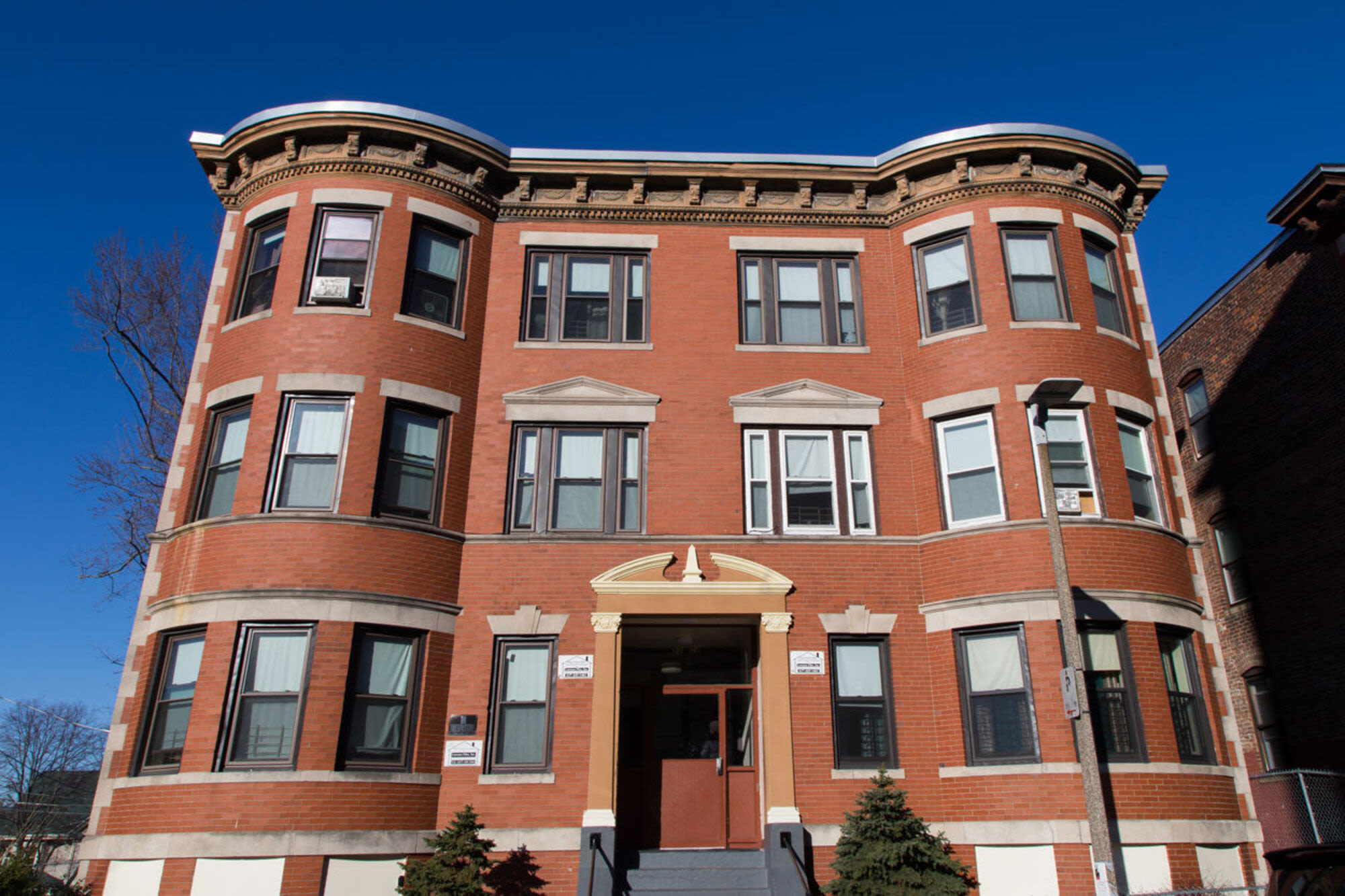 Entrance view of apartment kitchen at JPNDC Pitts Portfolio in Roxbury,Massachusetts