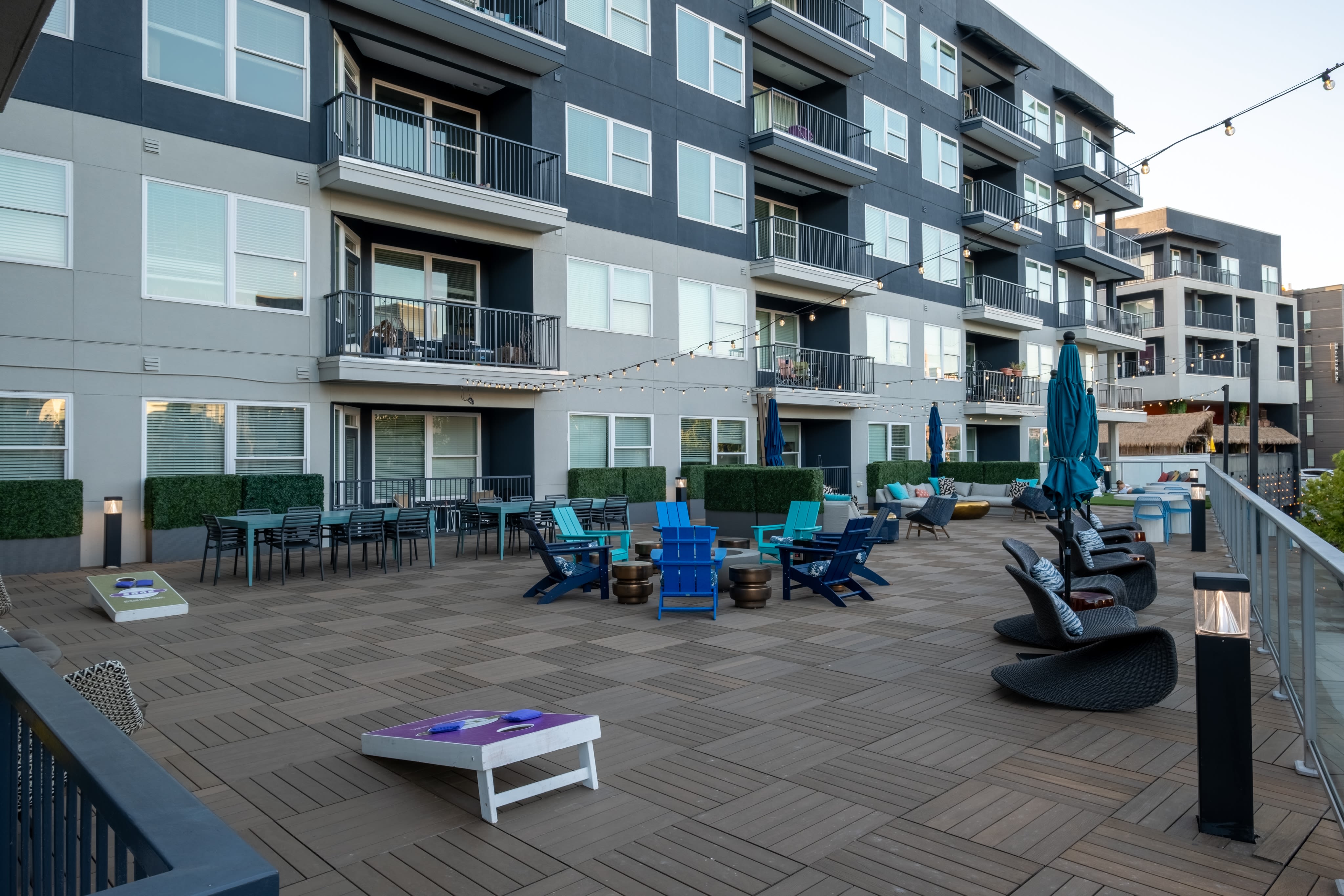 Outdoor Amenity Deck With Curved Lounge Chairs at EDGE on the Beltline in Atlanta, Georgia