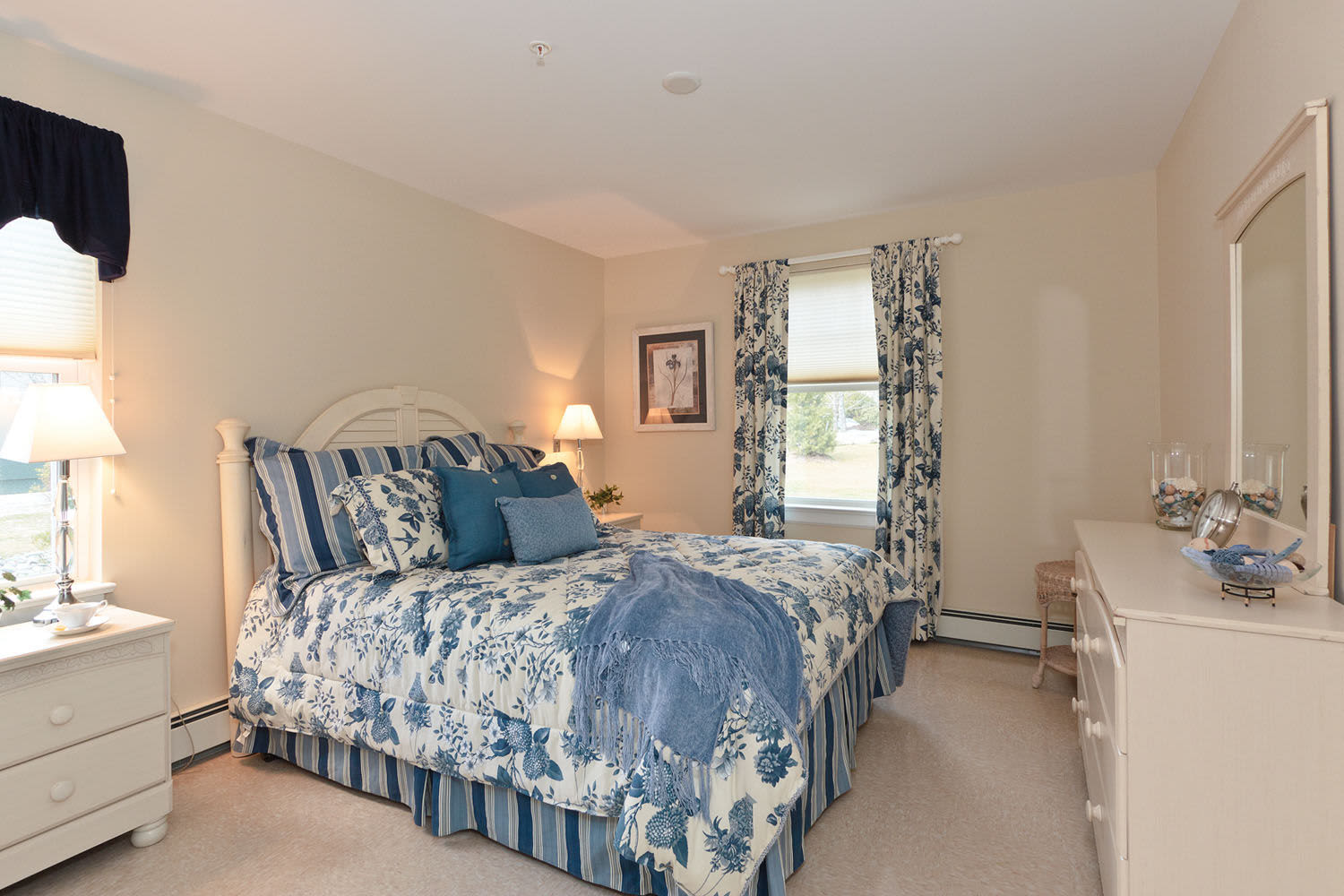 Bedroom showing a comfortable bed at Little Neck Village in Marion, Massachusetts
