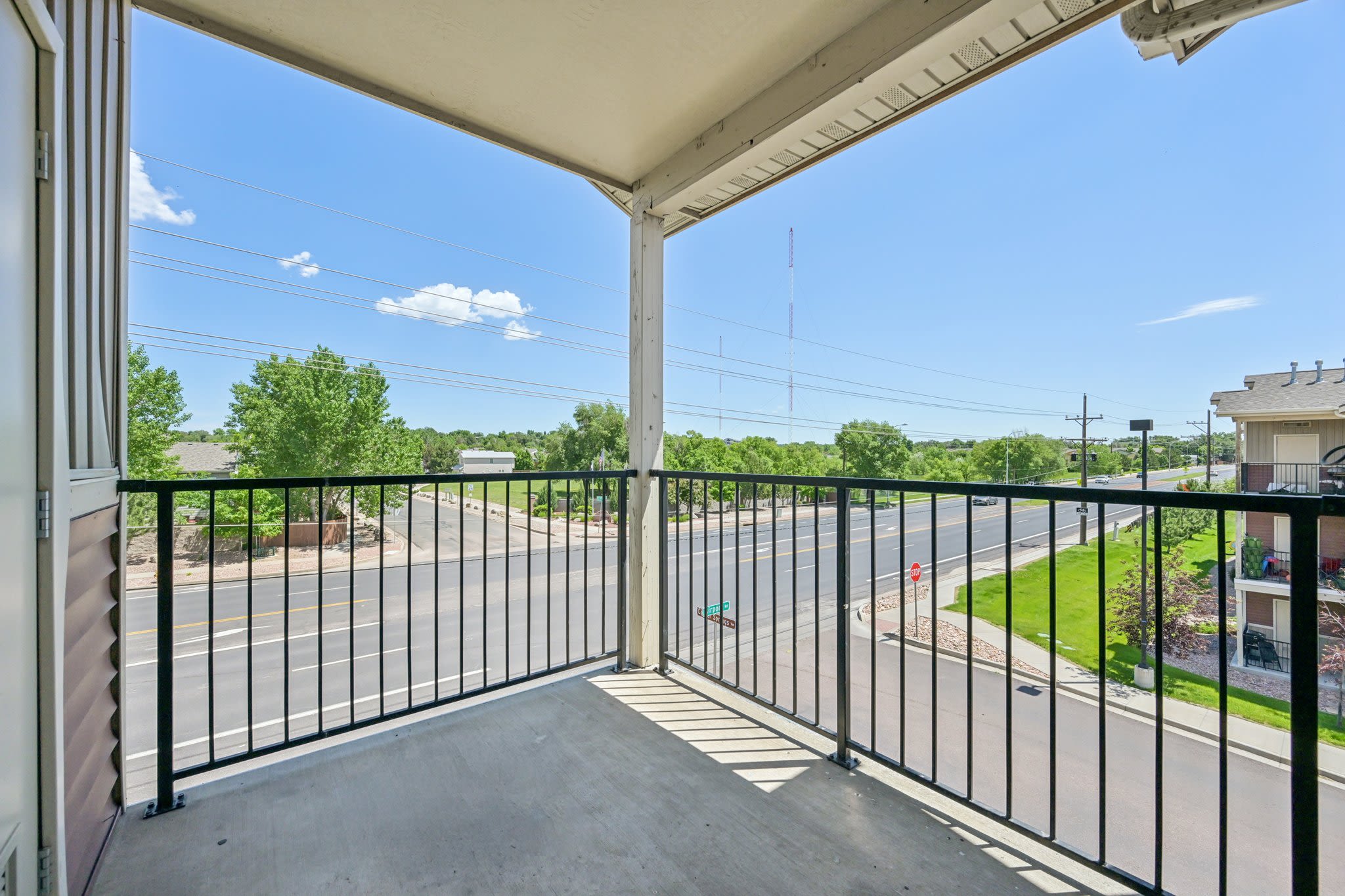 A resident sitting on her private patio at Copper Creek in Colorado Springs, Colorado