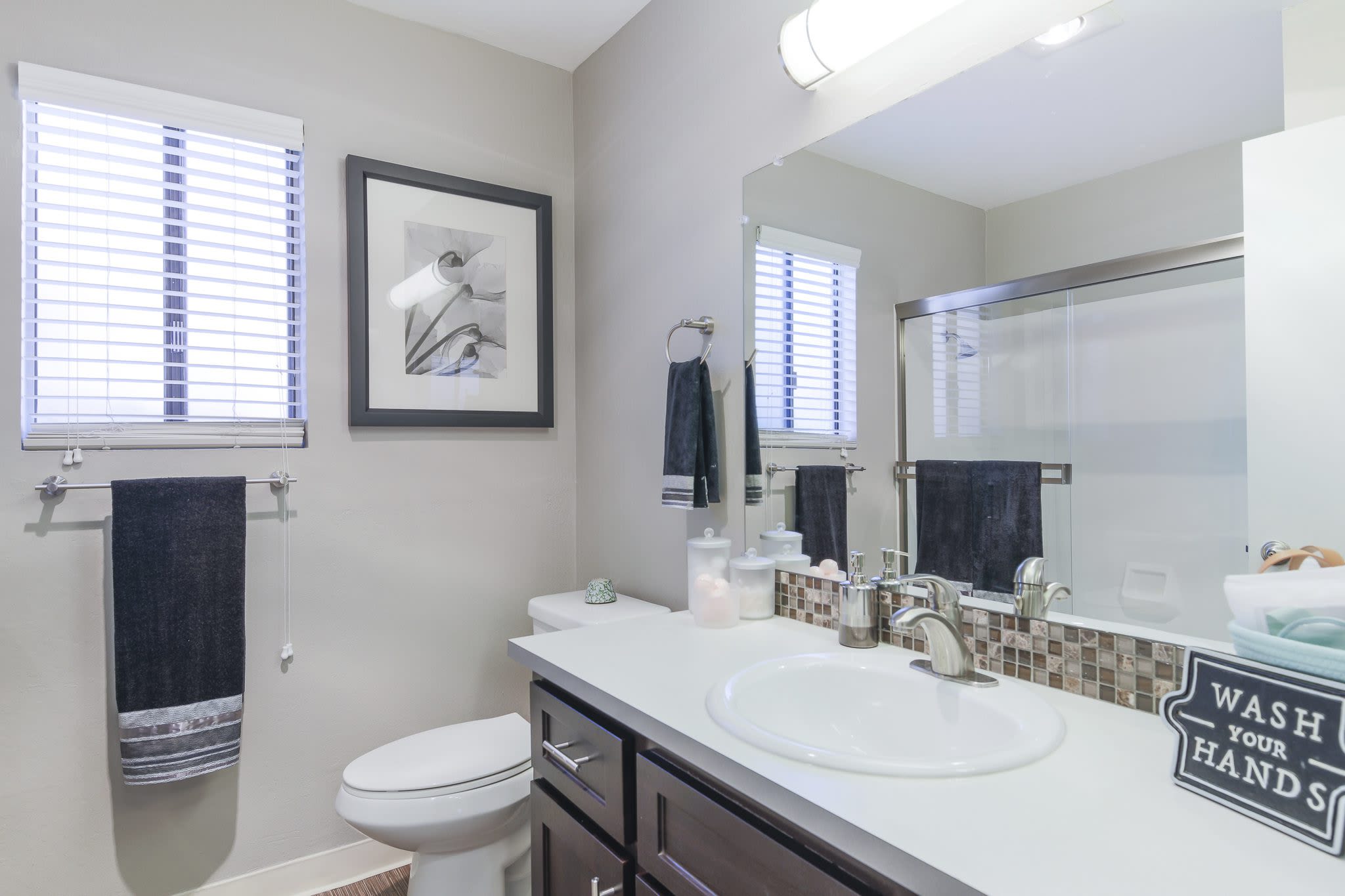 Bright bathroom at Woodchase Apartments in San Leandro, California