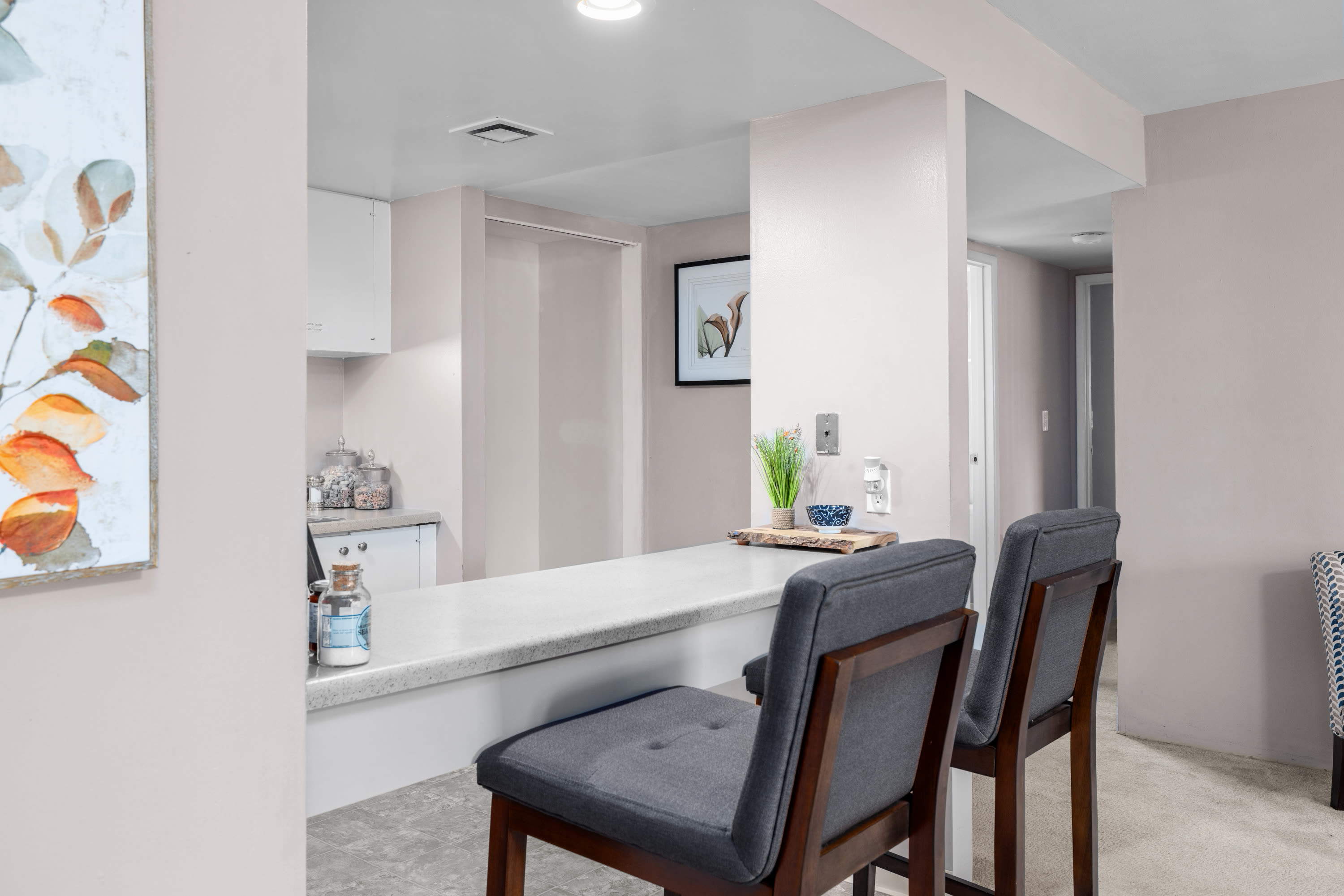 Breakfast counter with two chairs at West End Terrace Apartments in St. Louis, Missouri