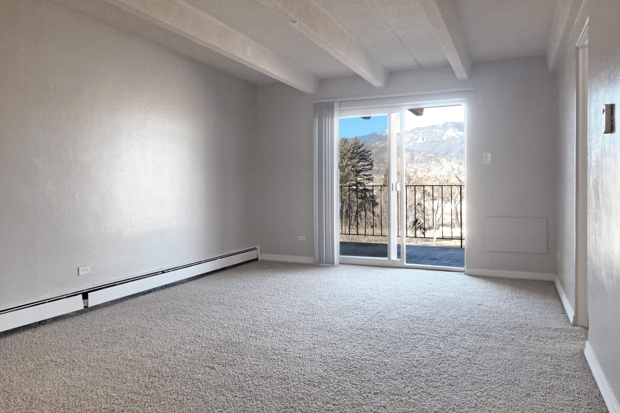 Living room with sliding door at Boulder Crescent in Colorado Springs,Colorado