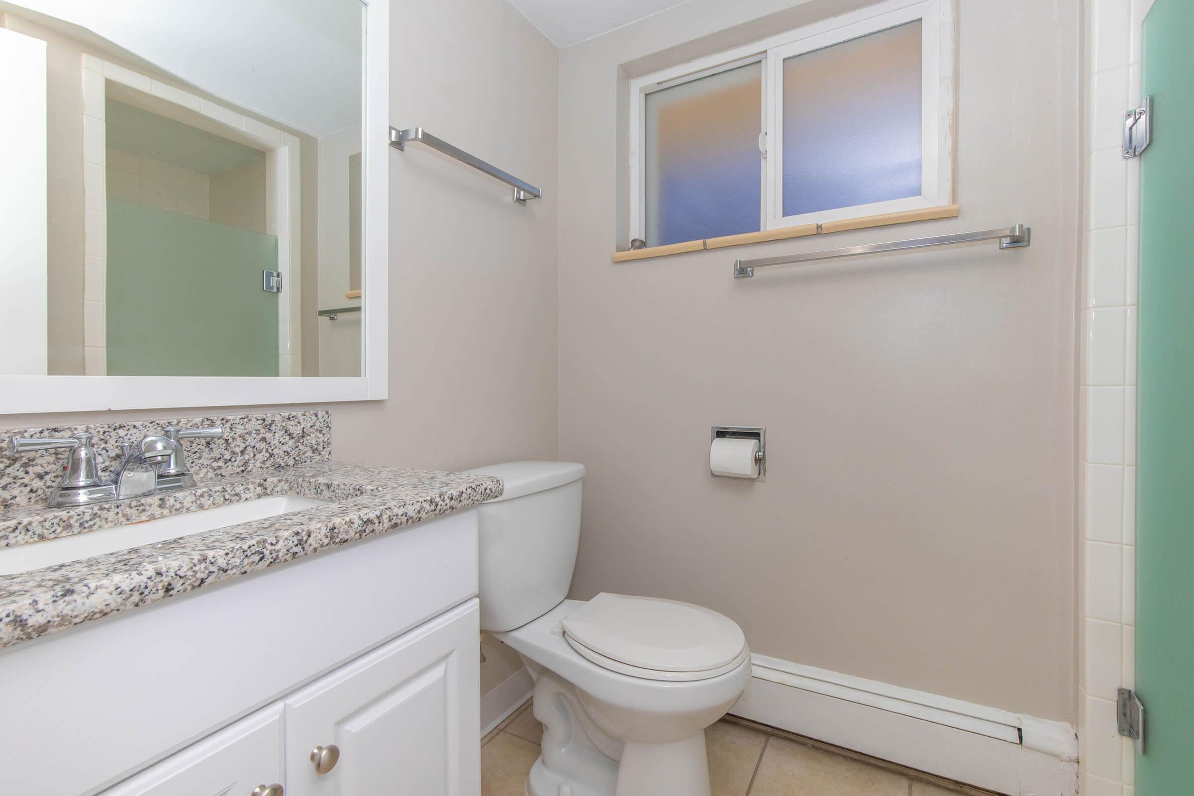 Bathroom with solid vanity at Boulder Crescent in Colorado Springs, Colorado