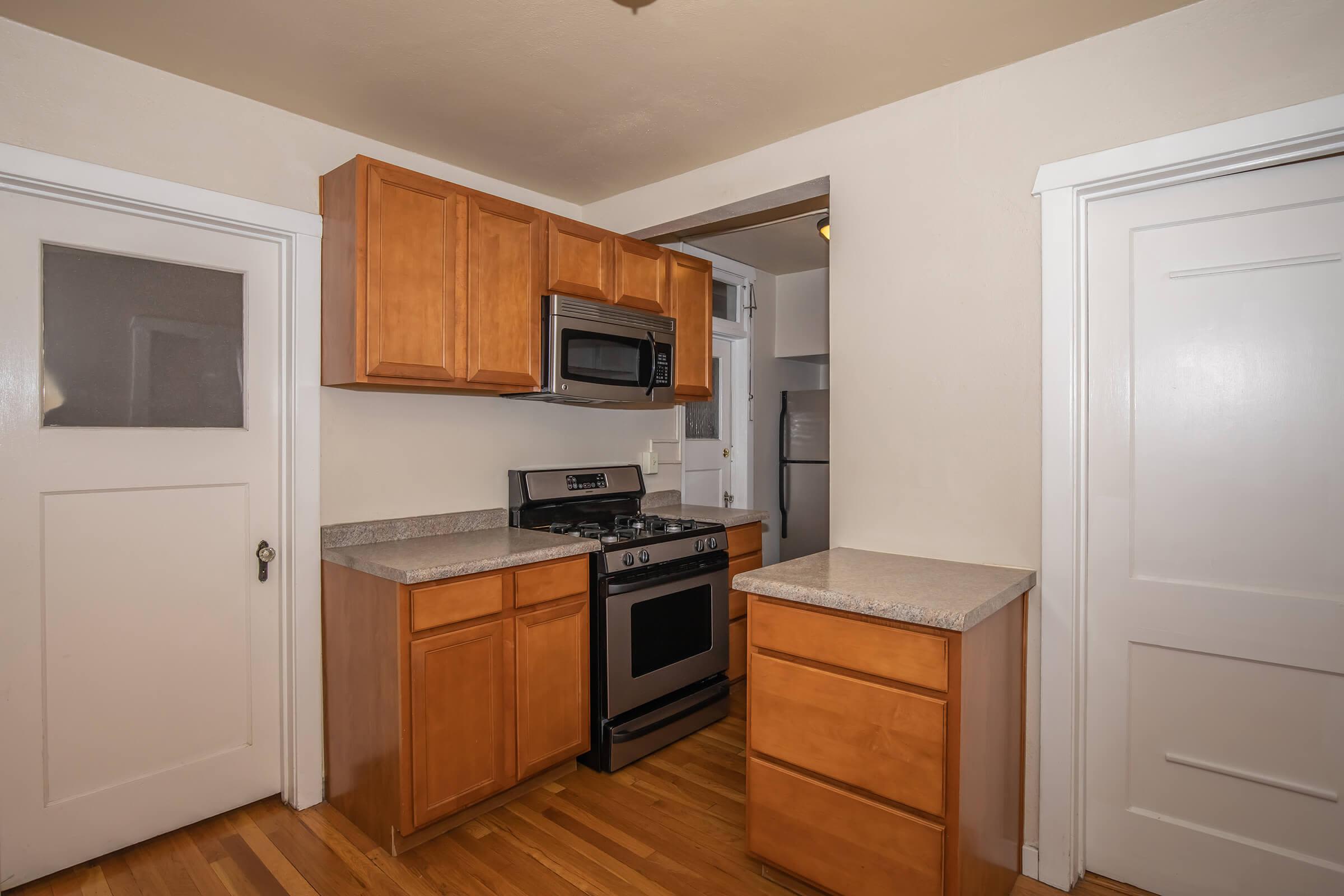 Kitchen with black appliances at Cascade Park in Colorado Springs, Colorado