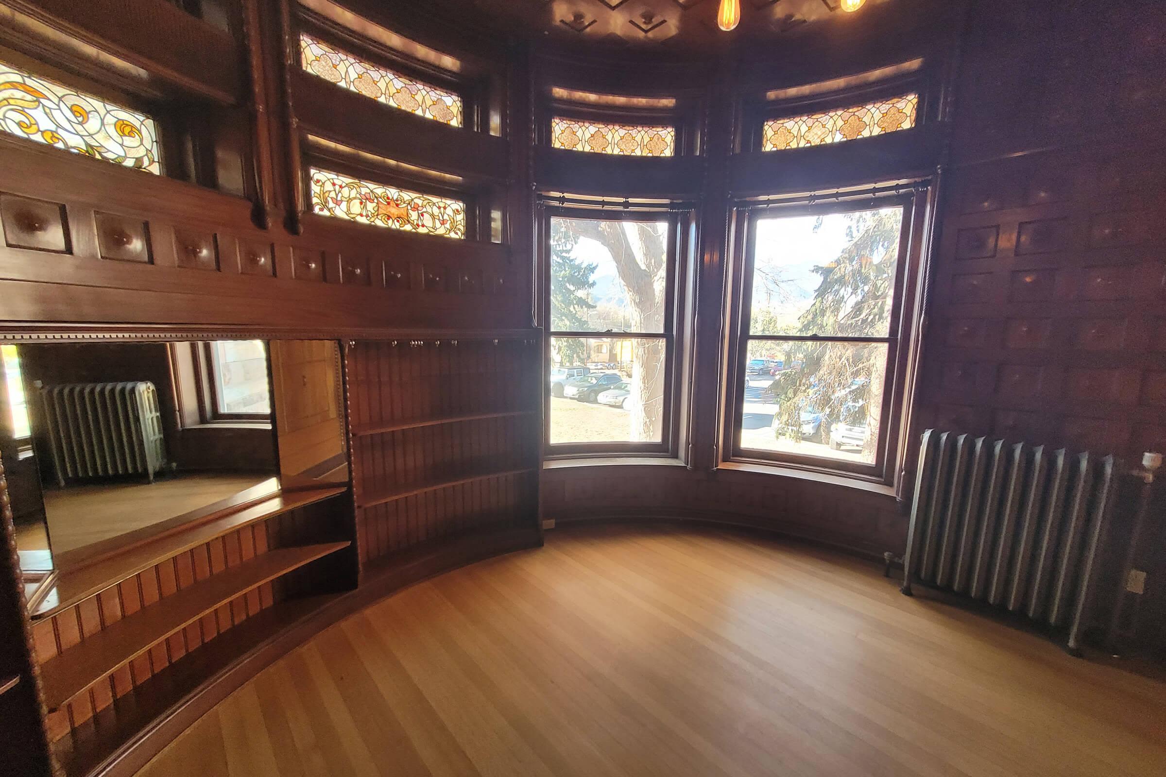 Bay windows surrounded by wooden trimmed walls at Cascade Park in Colorado Springs, Colorado