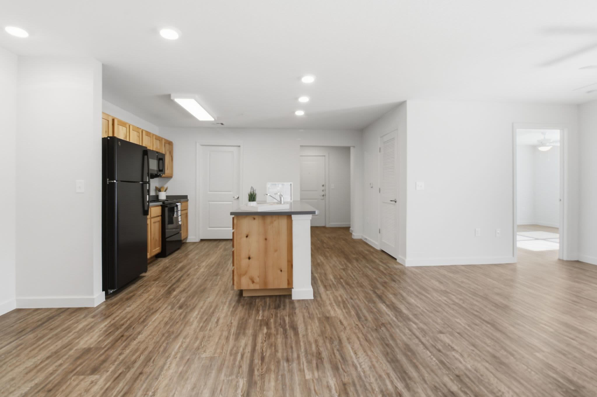 Unfurnished dining area with view to kitchen at Butler Park in Andrews, Texas