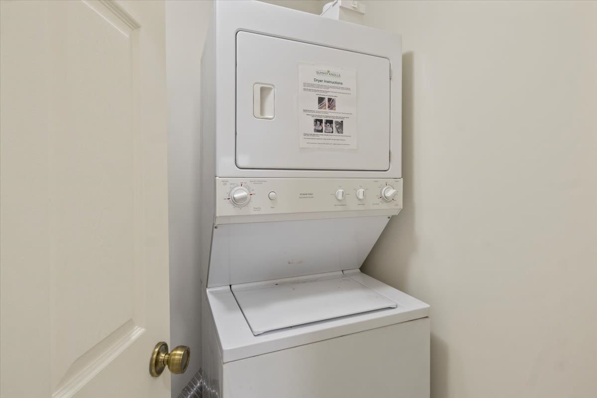 Stacked washer and dryer at Summit Knolls Apartments & Townhomes in Webster, New York