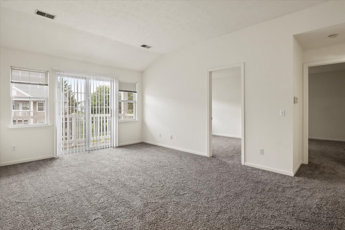 Living space with connecting rooms at Summit Knolls Apartments & Townhomes in Webster, New York