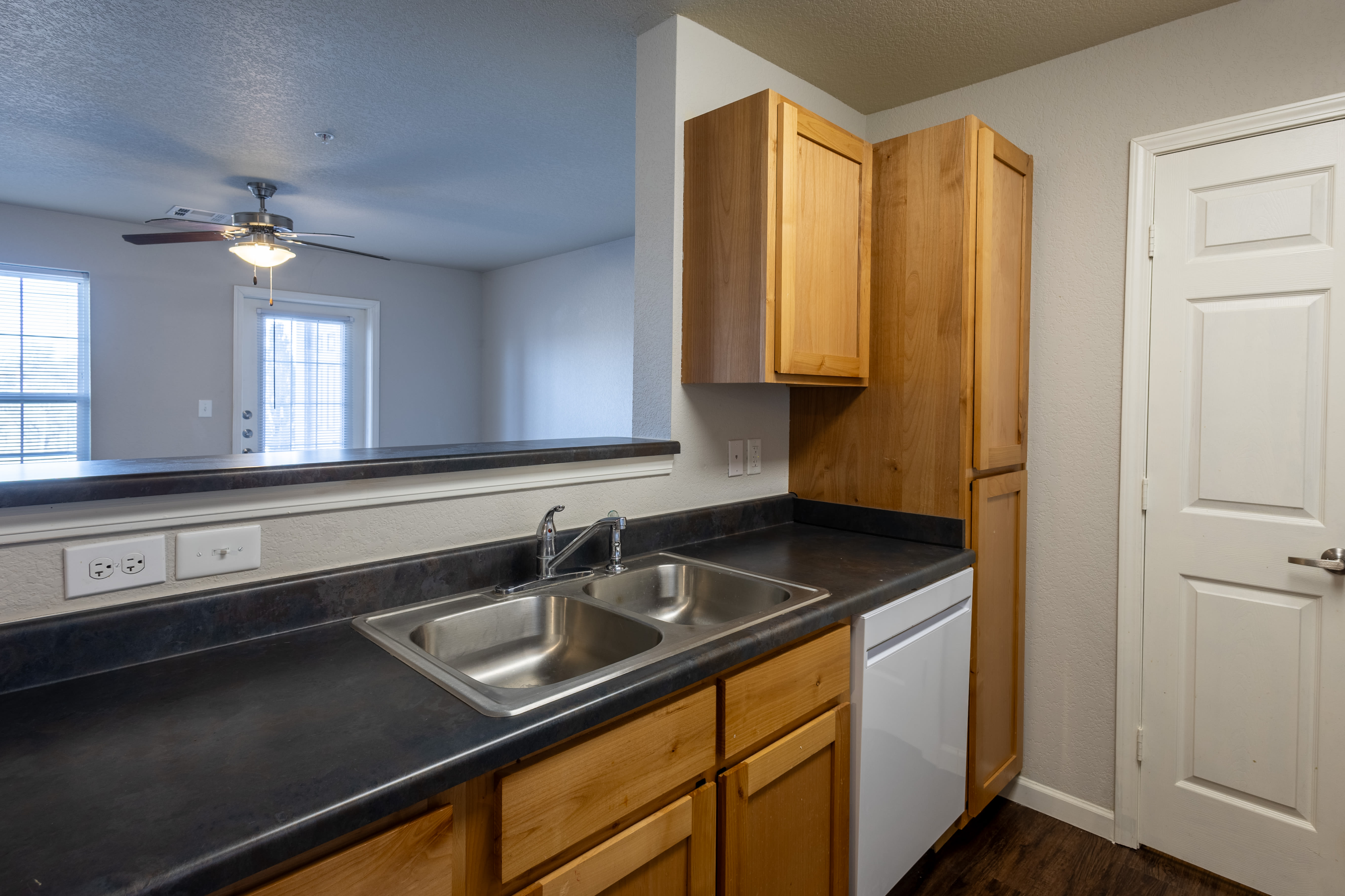 Kitchen with sink and cupboards at Harvest Park in Pampa, Texas